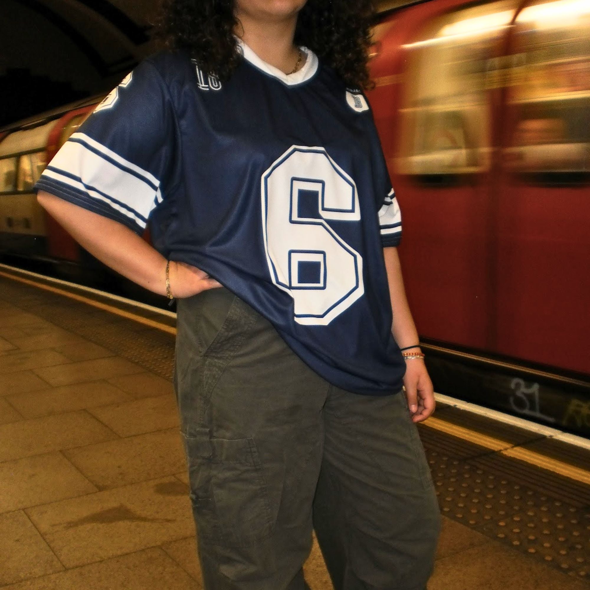 A navy blue football jersey with Isack Hadjars Redbull F1 Racing number 6 on the front and back.