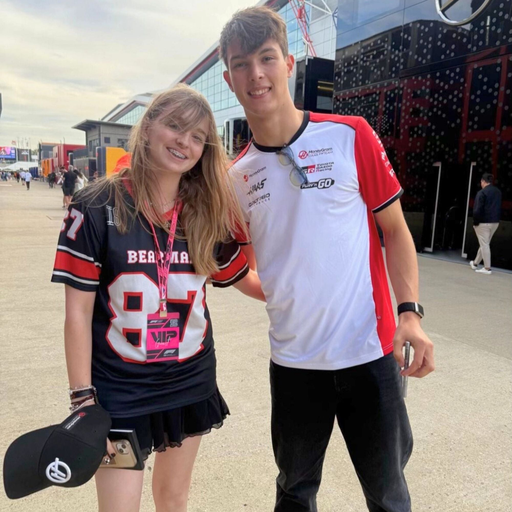 A black and red football jersey with Oliver Bearman's Haas F1 Racing number 87 in white on the front and back.