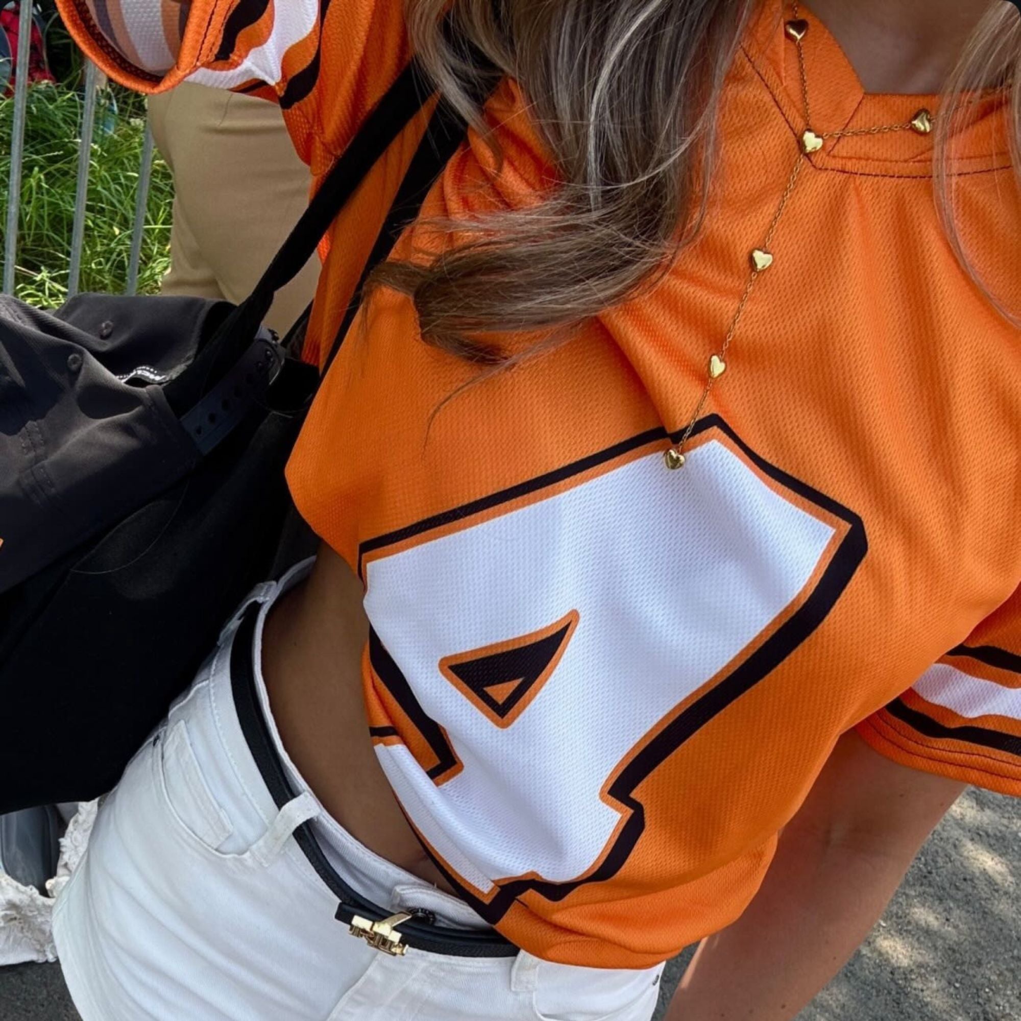 A papaya orange football jersey with Lando Norris's McLaren F1 Racing number 4 on the front and back.