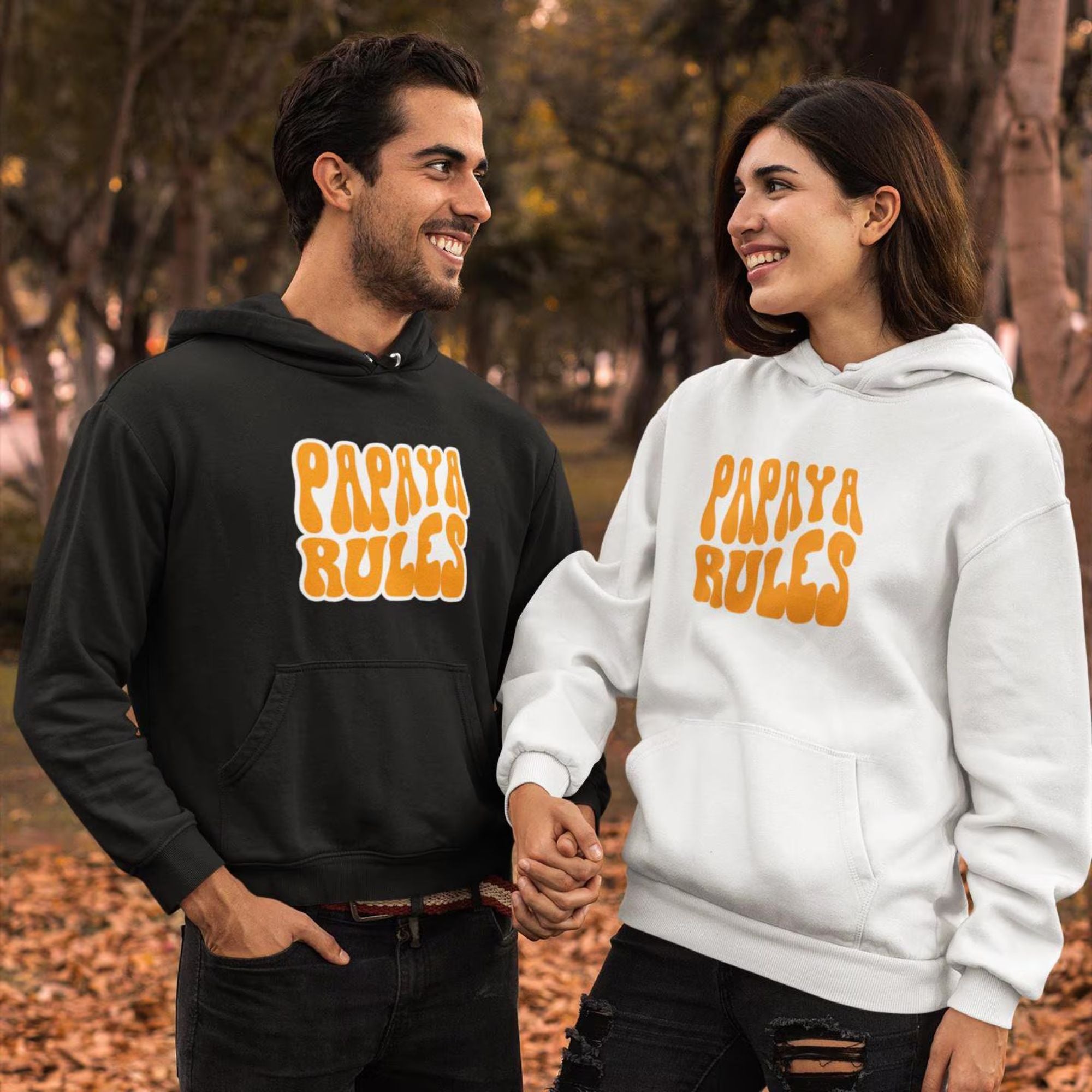 A white heavy blend hoodie with the text Papaya Rules in orange on the front in the center.
