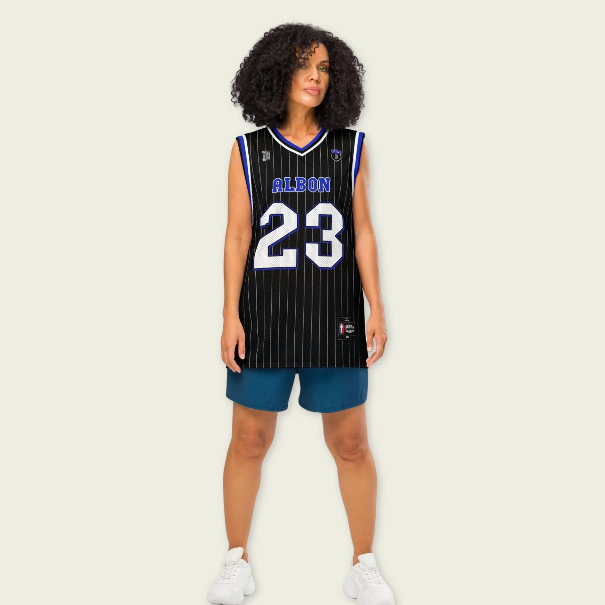 A black and blue pin striped basketball Jersey with Alex Albon's Williams F1 racing number 23 in white and blue on the front and back.