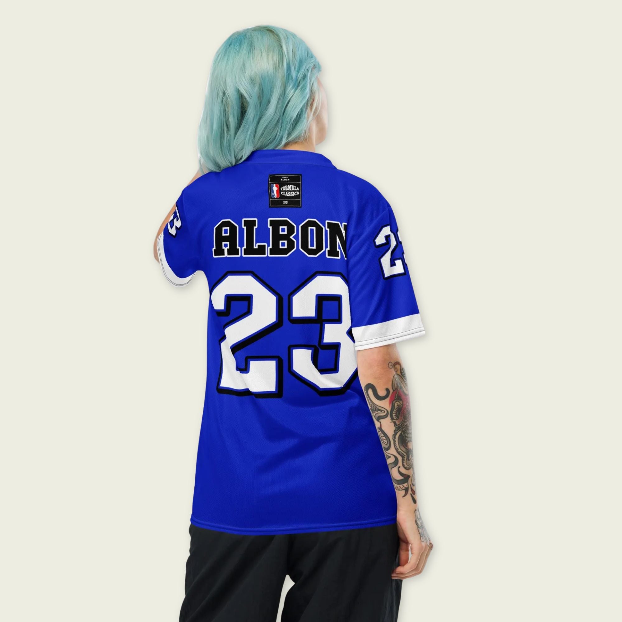 A blue and white football jersey with Alex Albon's Williams F1 racing number 23 on the back and front in white. It has the name Hamilton in red on the front and back as well.