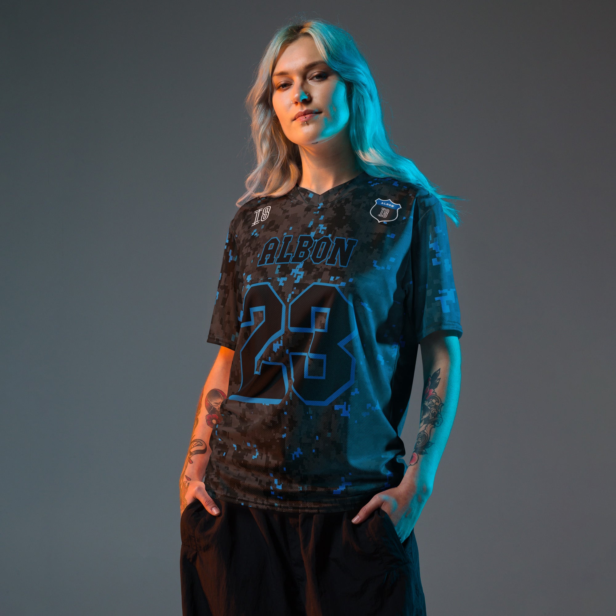 A camoflauge williams blue and black digital camo styled football jersey with  Alex Albons Williams F1 Racing number 23 on the front and back.