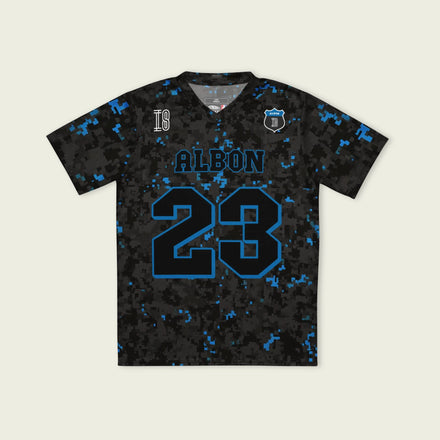 A camoflauge williams blue and black digital camo styled football jersey with  Alex Albons Williams F1 Racing number 23 on the front and back.