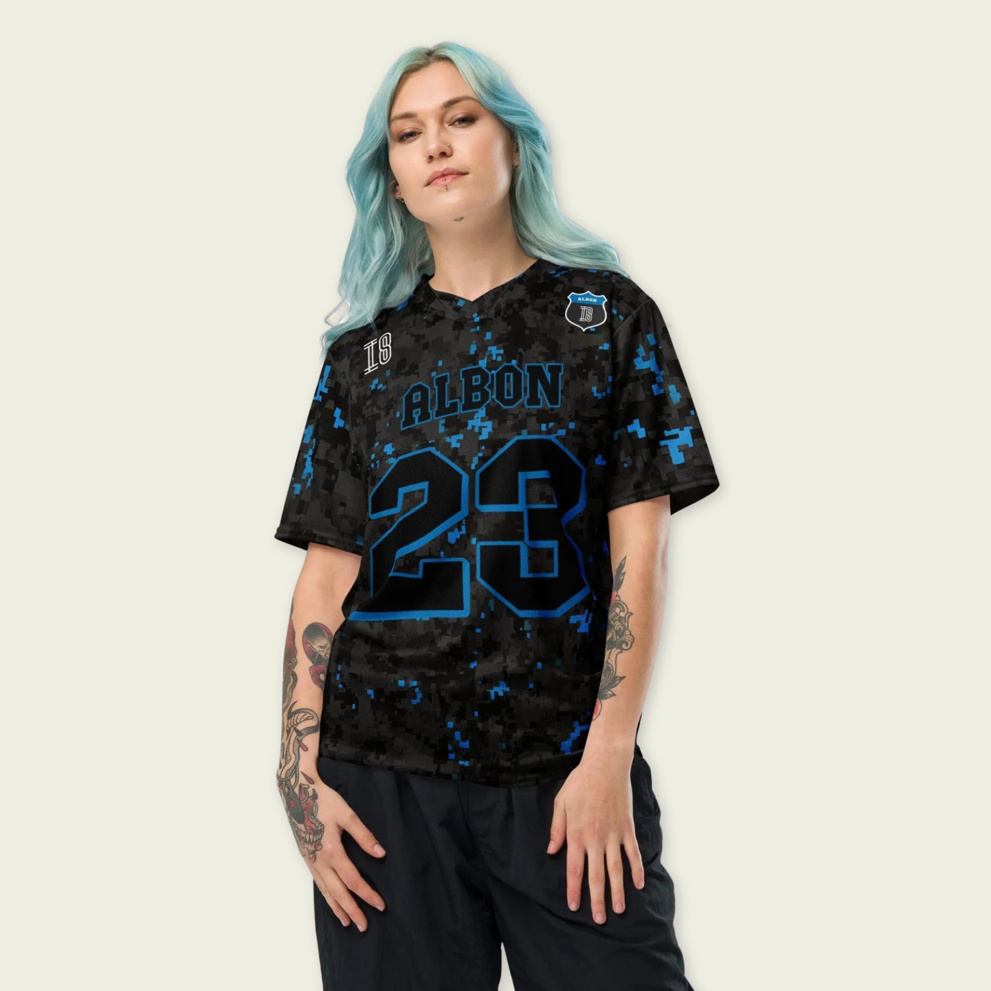 A camoflauge williams blue and black digital camo styled football jersey with  Alex Albons Williams F1 Racing number 23 on the front and back.