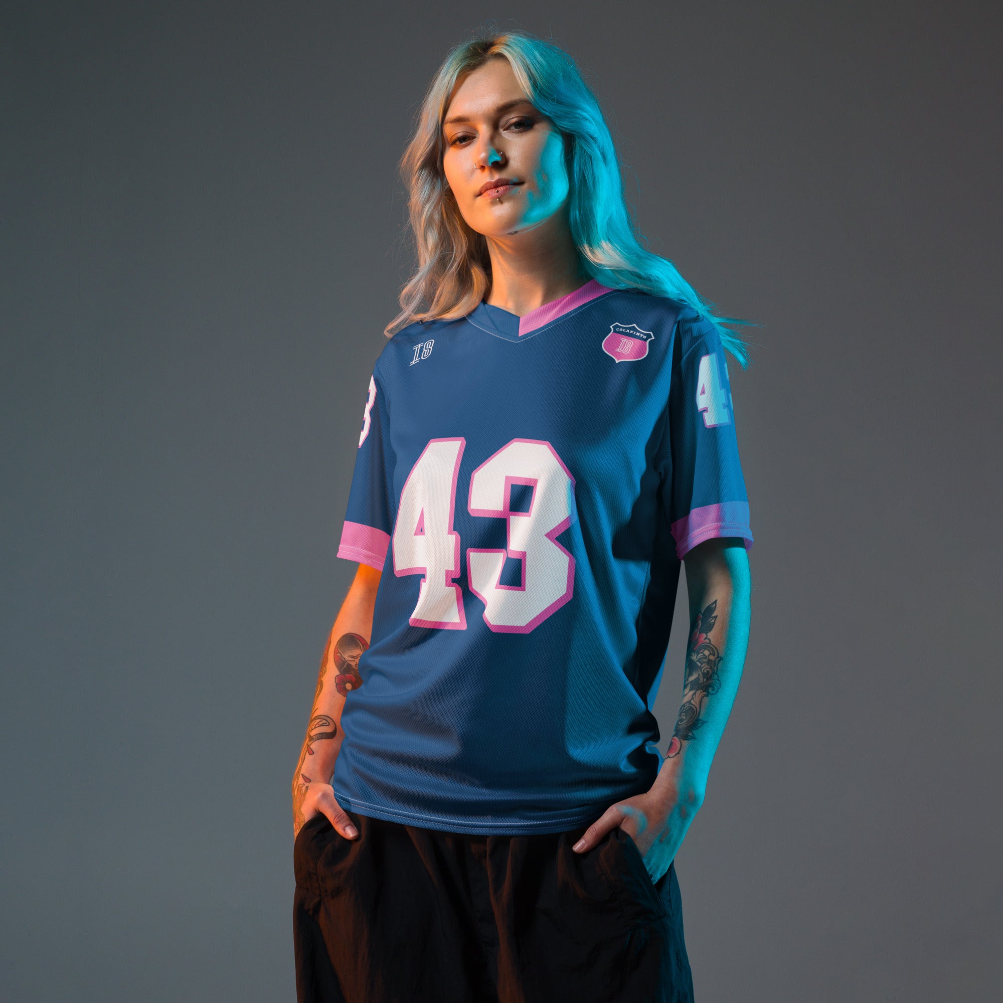 A navy blue and pink football jersey with Franco Colapinto's Alpine F1 Racing number 43 in white on the front and back.