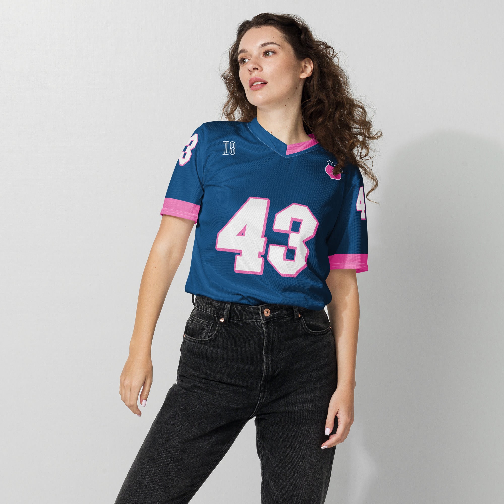 A navy blue and pink football jersey with Franco Colapinto's Alpine F1 Racing number 43 in white on the front and back.