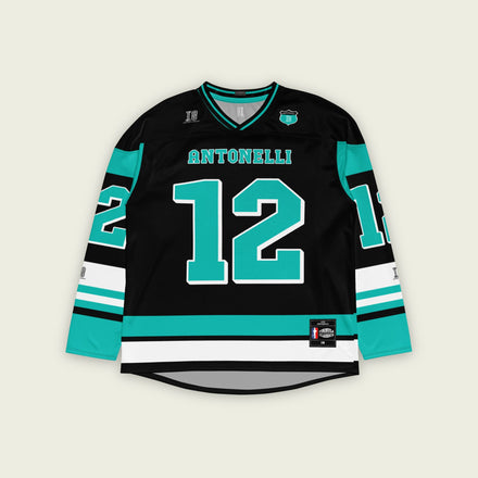 A black and turquoise hockey jersey with Andrea Kimi Antonelli's Mercedes F1 racing number 12 in turquoise on the front and back. It has the name Antonelli on the back and front in turquoise as well.