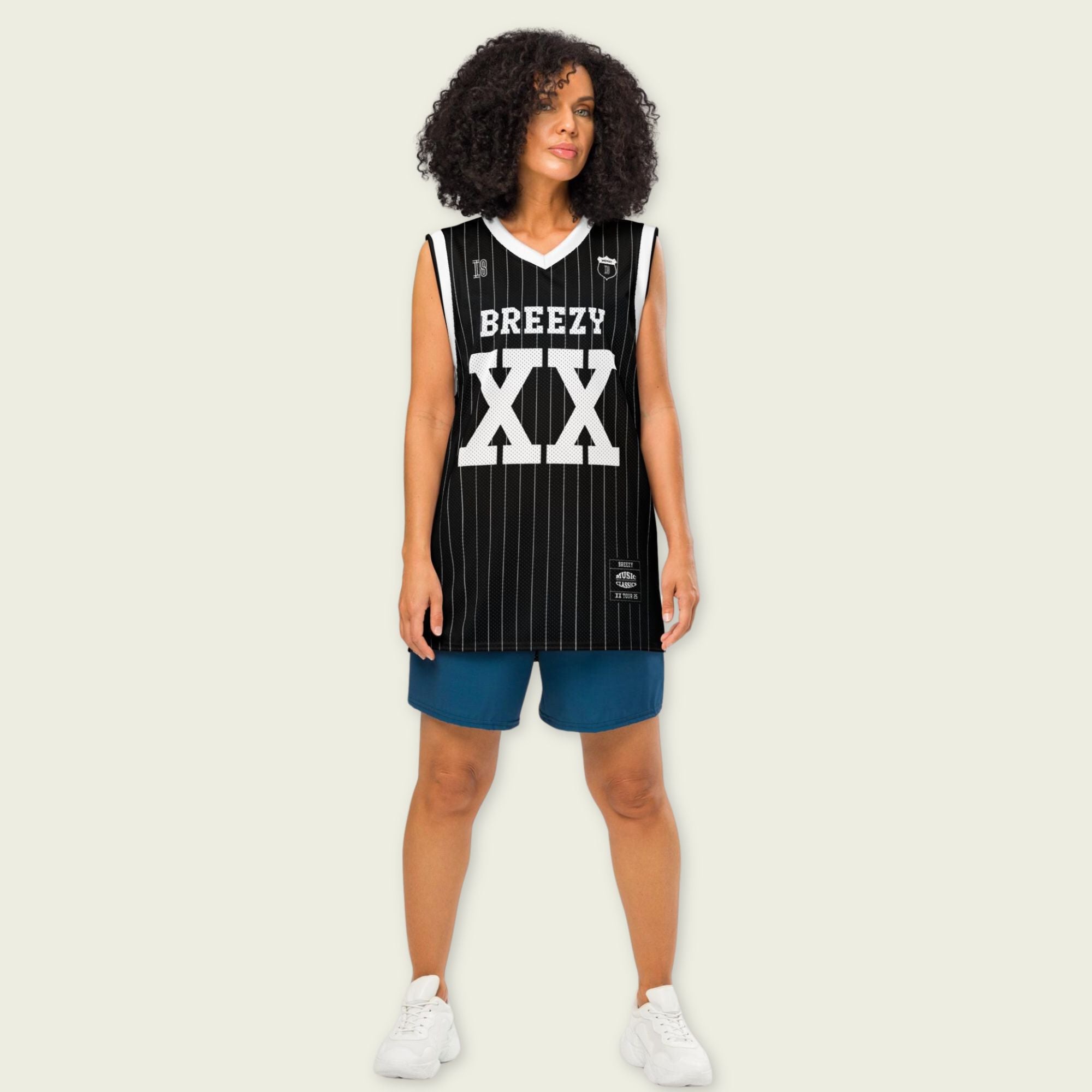 A black and white pin striped basketball Jersey with Chris Brown's Breezy name on the front and back and XX for his 11-11 tour in white, both on the front and back.