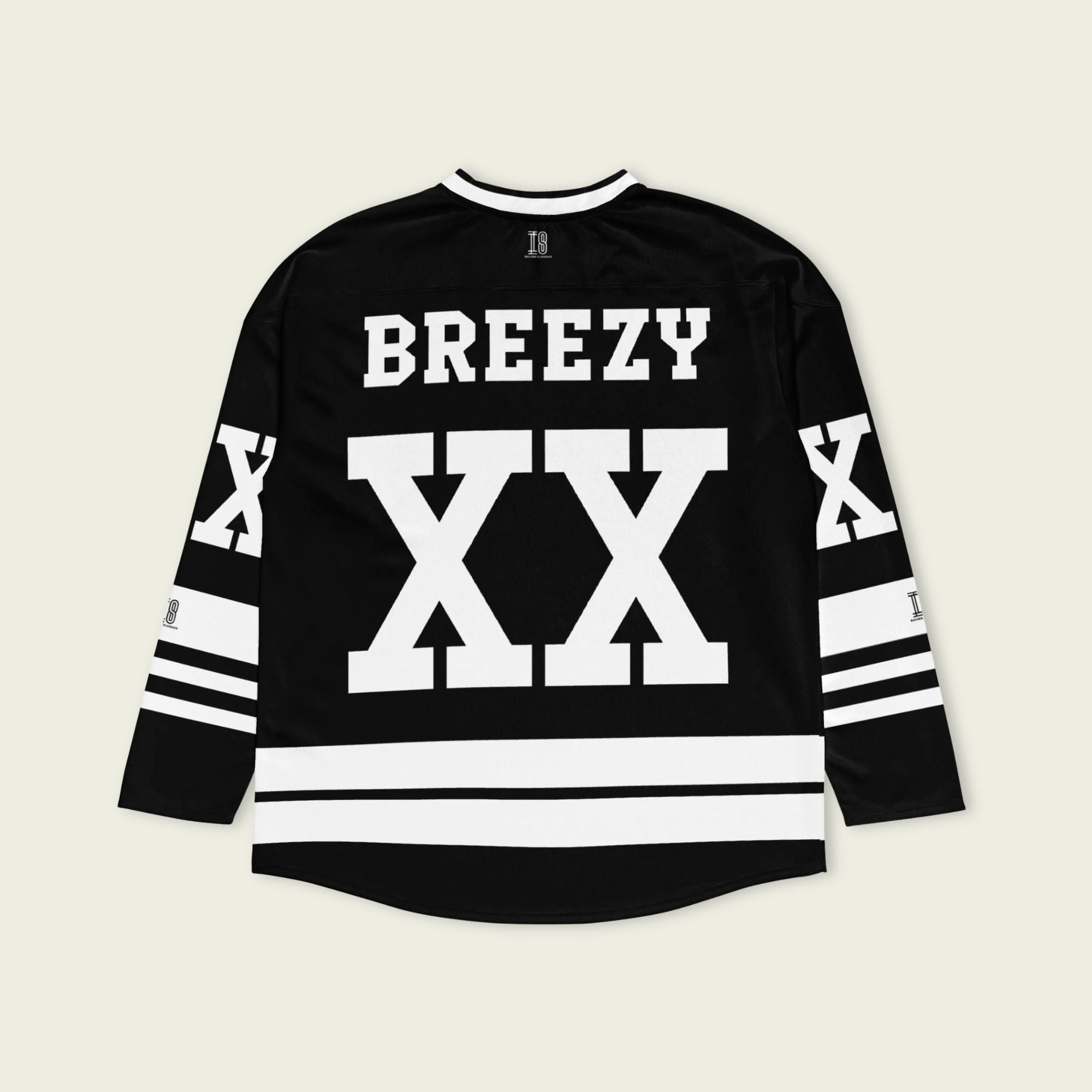 A Chris Brown Breezy Bowl Tour black and white hockey jersey with white lines showing the name Breezy on black on the back and XX on the front and back in white also.