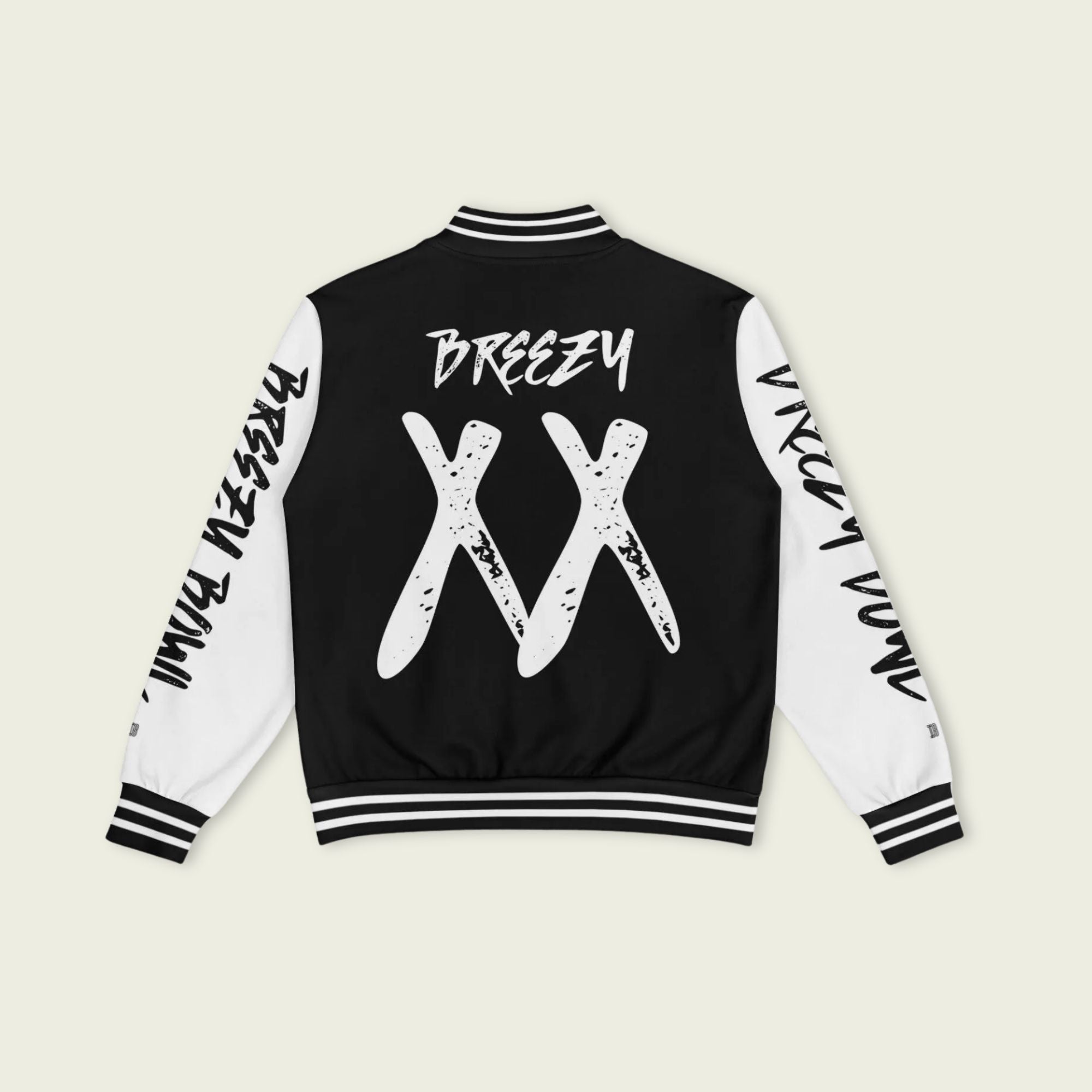 A black and white varsity jacket showing Chris Browns name Breezy on the back with XX and 11-11 breezy bowl tour