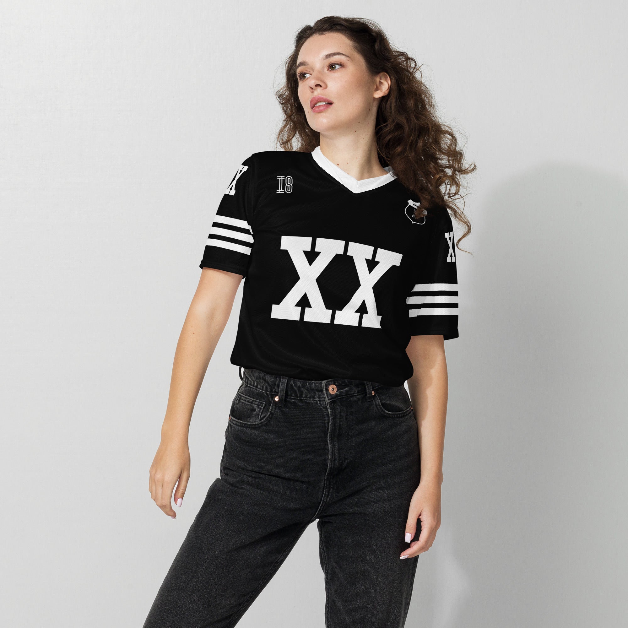 A Chris Brown black and white football jersey with XX and Breezy on the back and front in white.