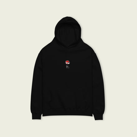 A black oversized hoodie with white text Charles Leclerc's racing number 16 on the front and Leclerc's graphic helmet on the front.