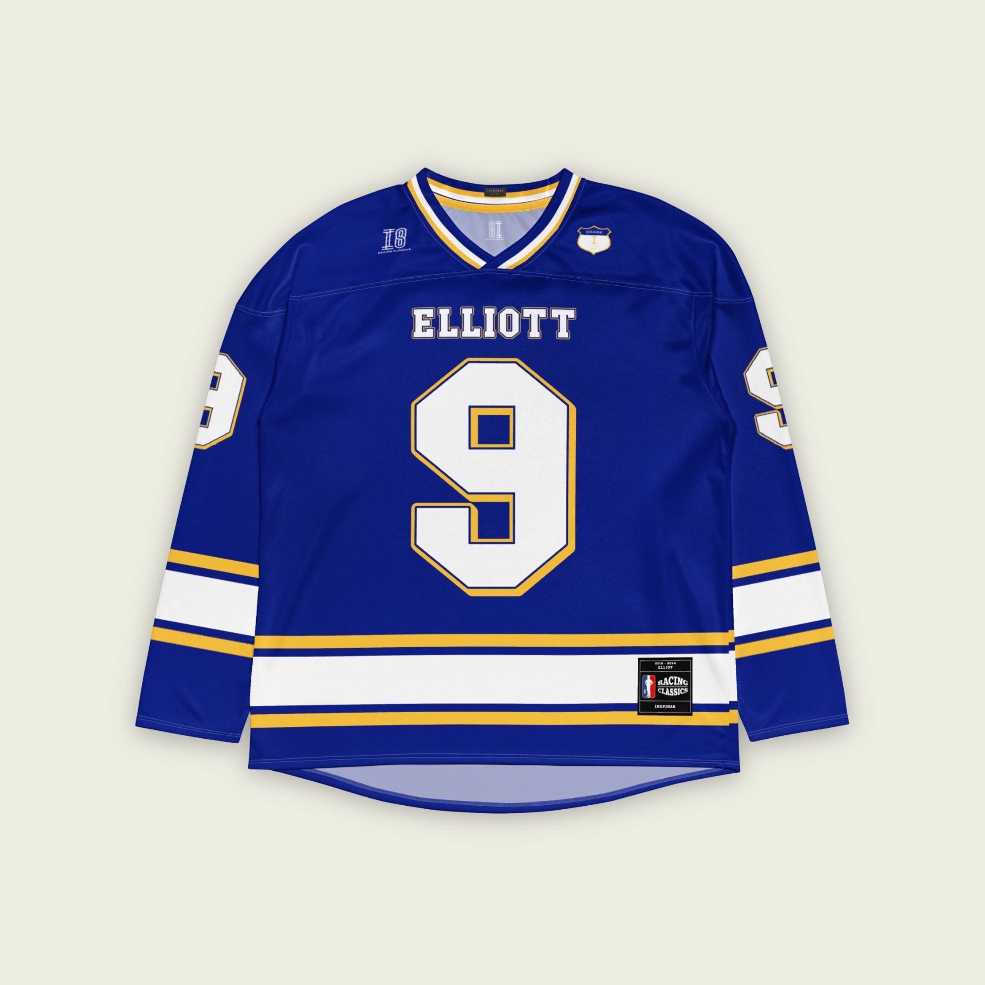 A Navy blue, white, and gold hockey jersey showing Chase Elliot's Nascar racing number 9 on the front and back with his name as well.