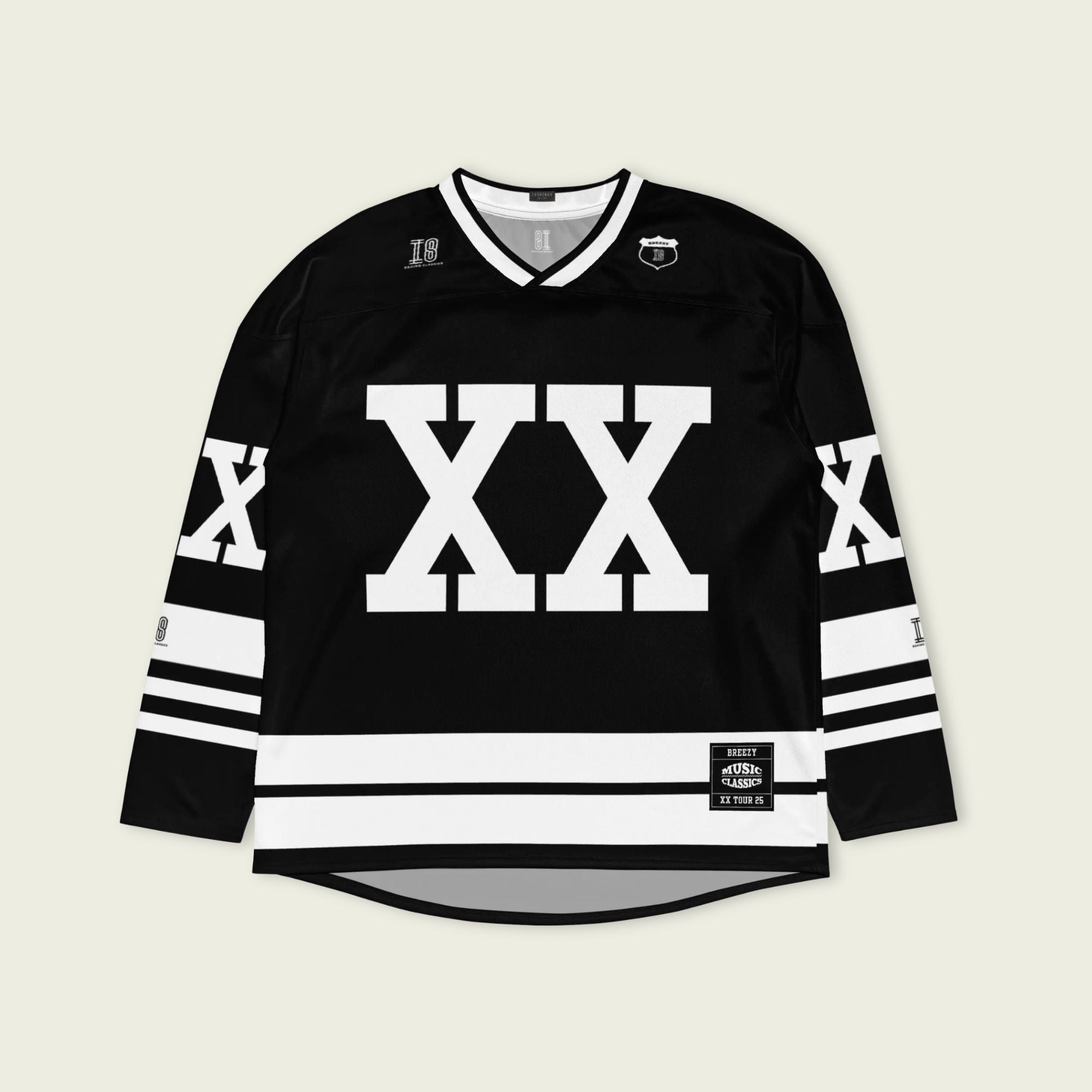 A Chris Brown Breezy Bowl Tour black and white hockey jersey with white lines showing the name Breezy on black on the back and XX on the front and back in white also.