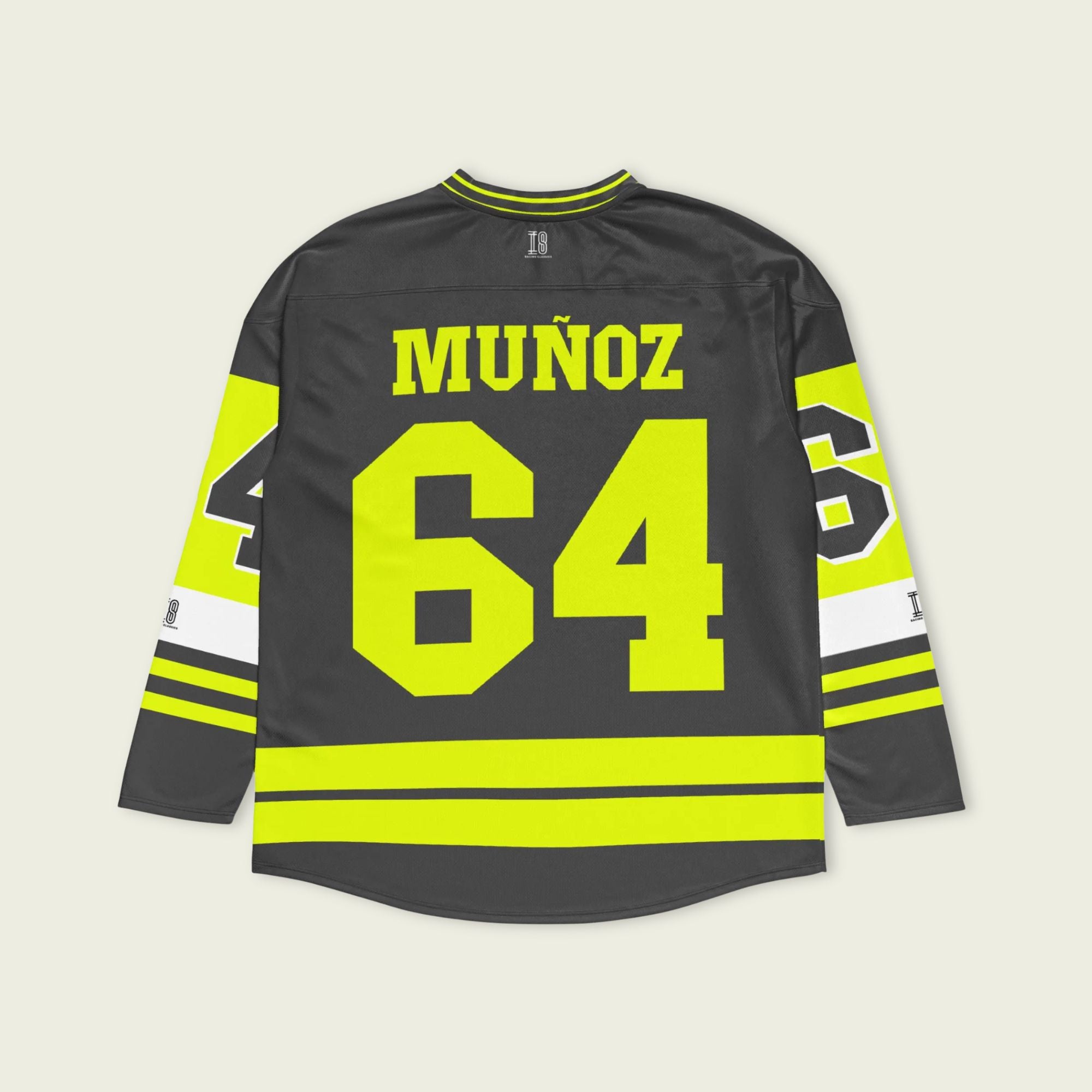 A Grey and highlight yellow hockey jersey with Daivd Munuzs name and moto gp racing number 64 on the front and back in yellow.