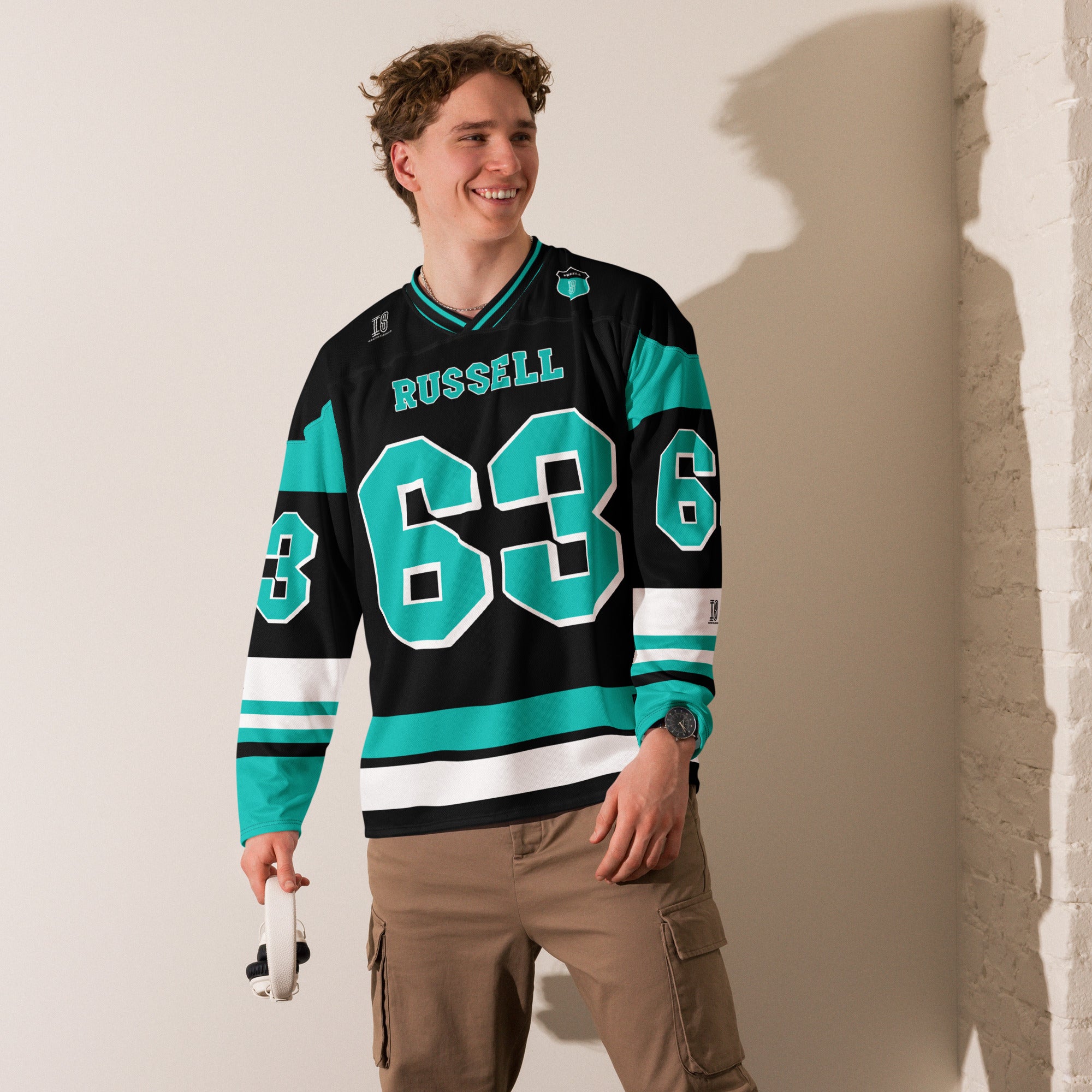 A black, green, and white hockey jersey with George Russells Mercedes F1 Racing number 63 in green on the front and back.