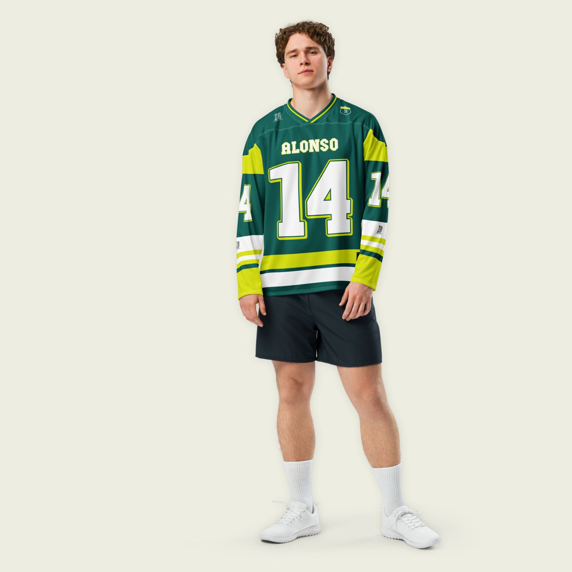 A British Green hockey jersey with Fernando Alonso's Aston Martin F1 racing number 14 in white on the front and back. It has the name Alonso on the back and front in white as well.