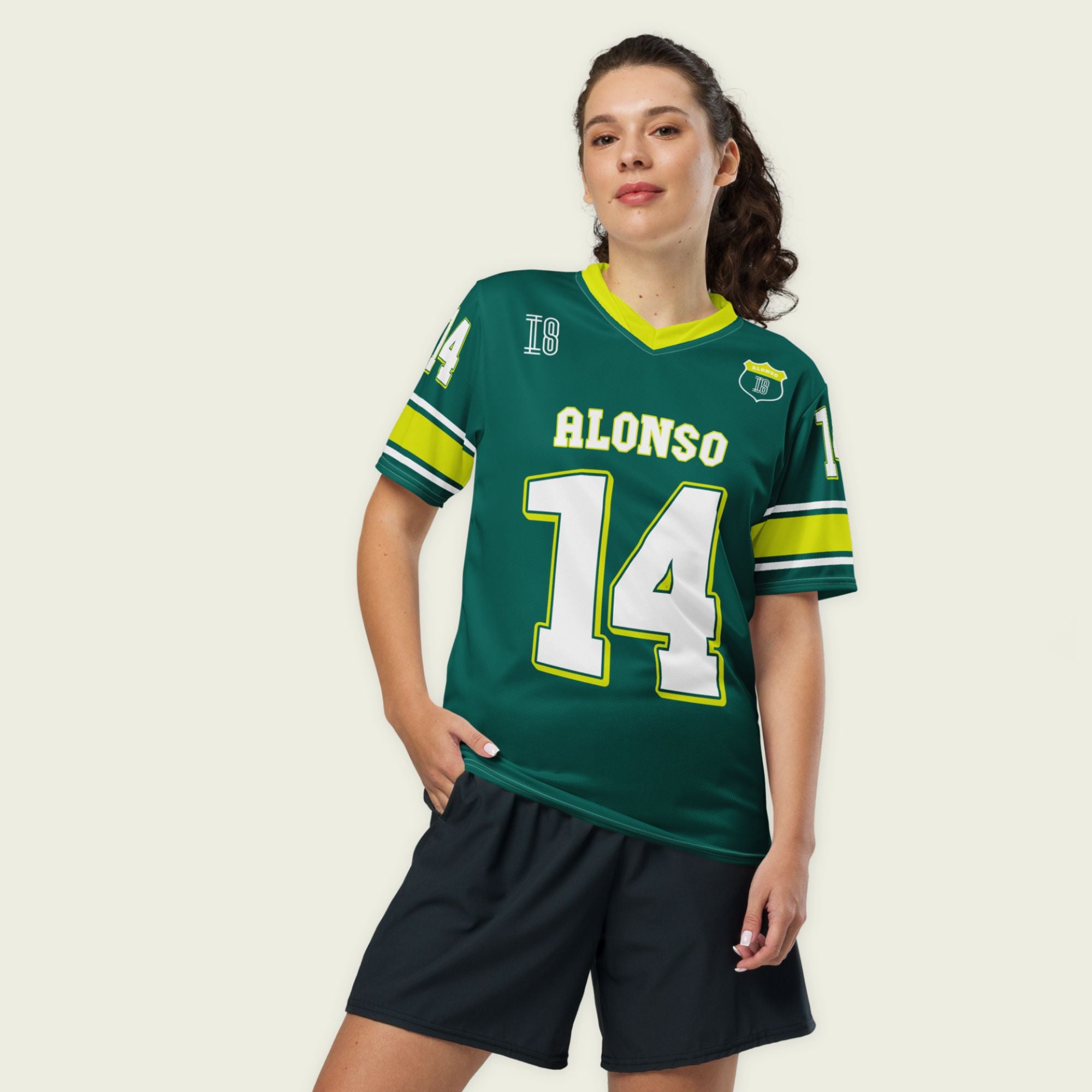 A dark green and highlight yellow football jersey with Fernando Alonso's Aston Martin F1 racing numer 14 on the front and back in white.