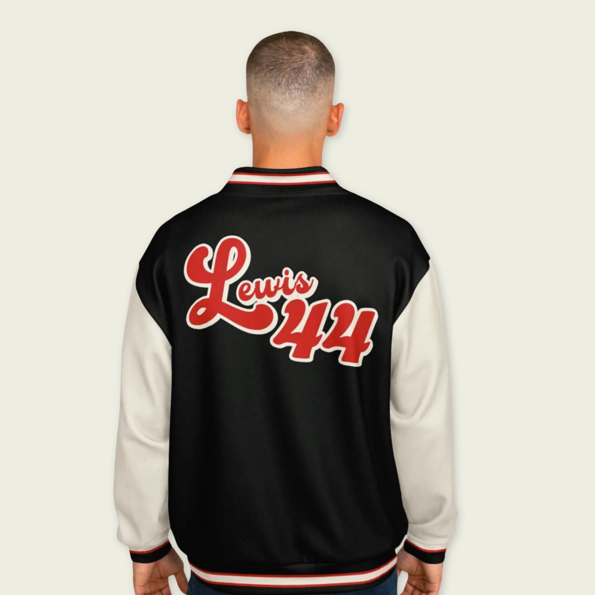 A black, red, and tan, varsity jacket with Lewis Hamilton's Ferrari F1 racing number 44 in red on the front and back.