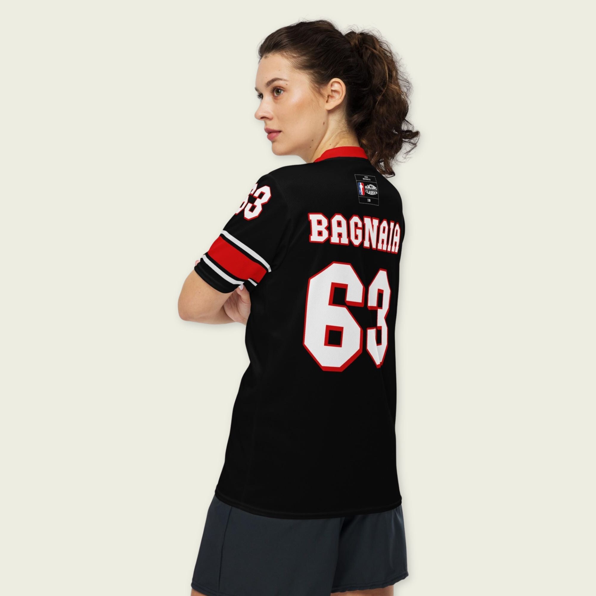 A black and red football jersey with Francesco Bagnaia Moto GP racing number 63 in white with a red outline.
