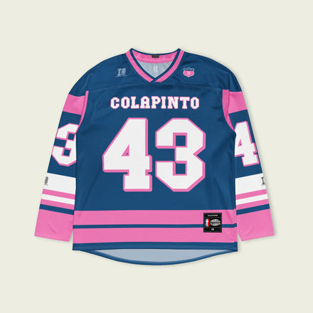 A navy blue and pink hockey jersey with Franco Colapinto's Alpine's F1 Racing number 43 in white on the front and back.