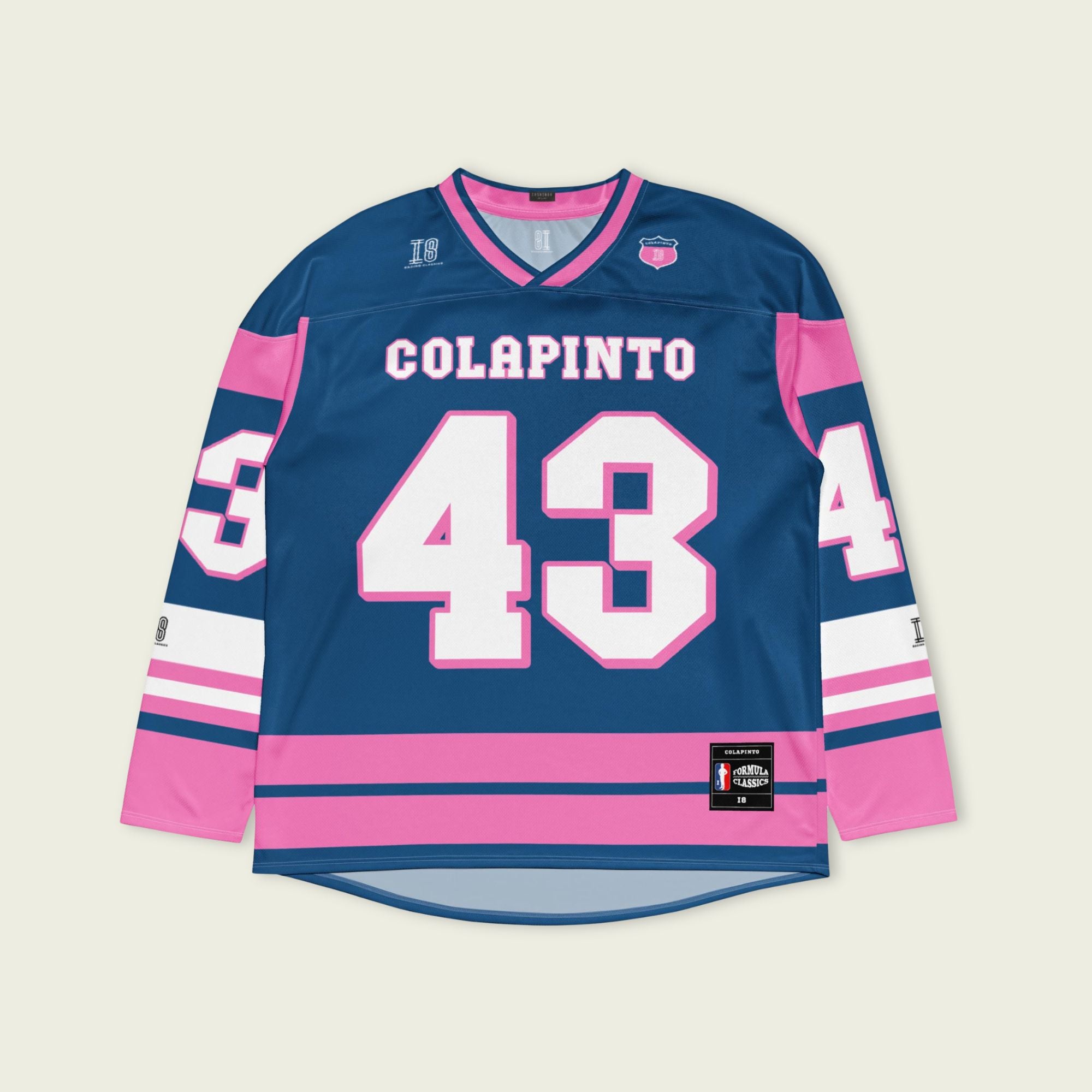A navy blue and pink hockey jersey with Franco Colapinto's Alpine's F1 Racing number 43 in white on the front and back.