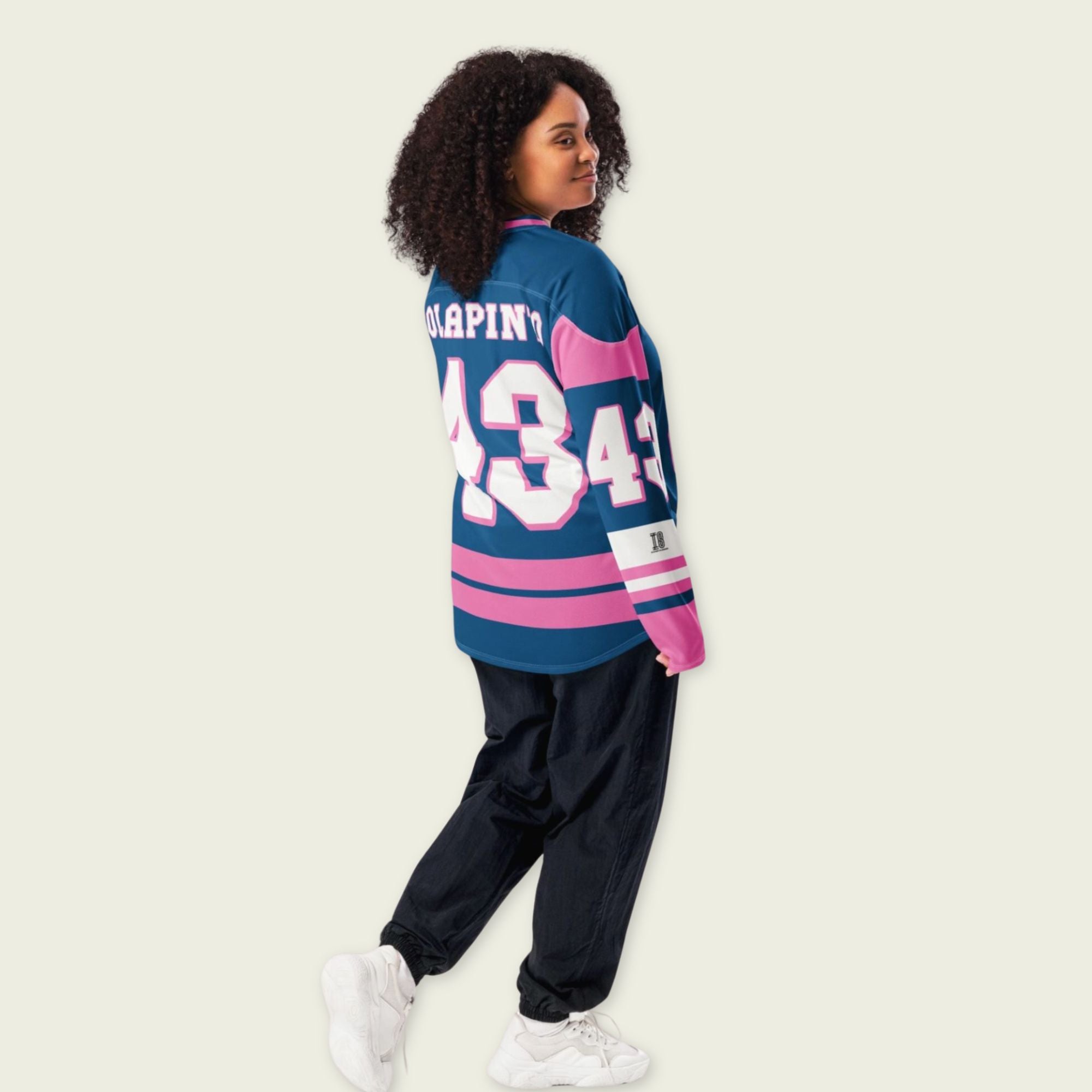 A navy blue and pink hockey jersey with Franco Colapinto's Alpine's F1 Racing number 43 in white on the front and back.