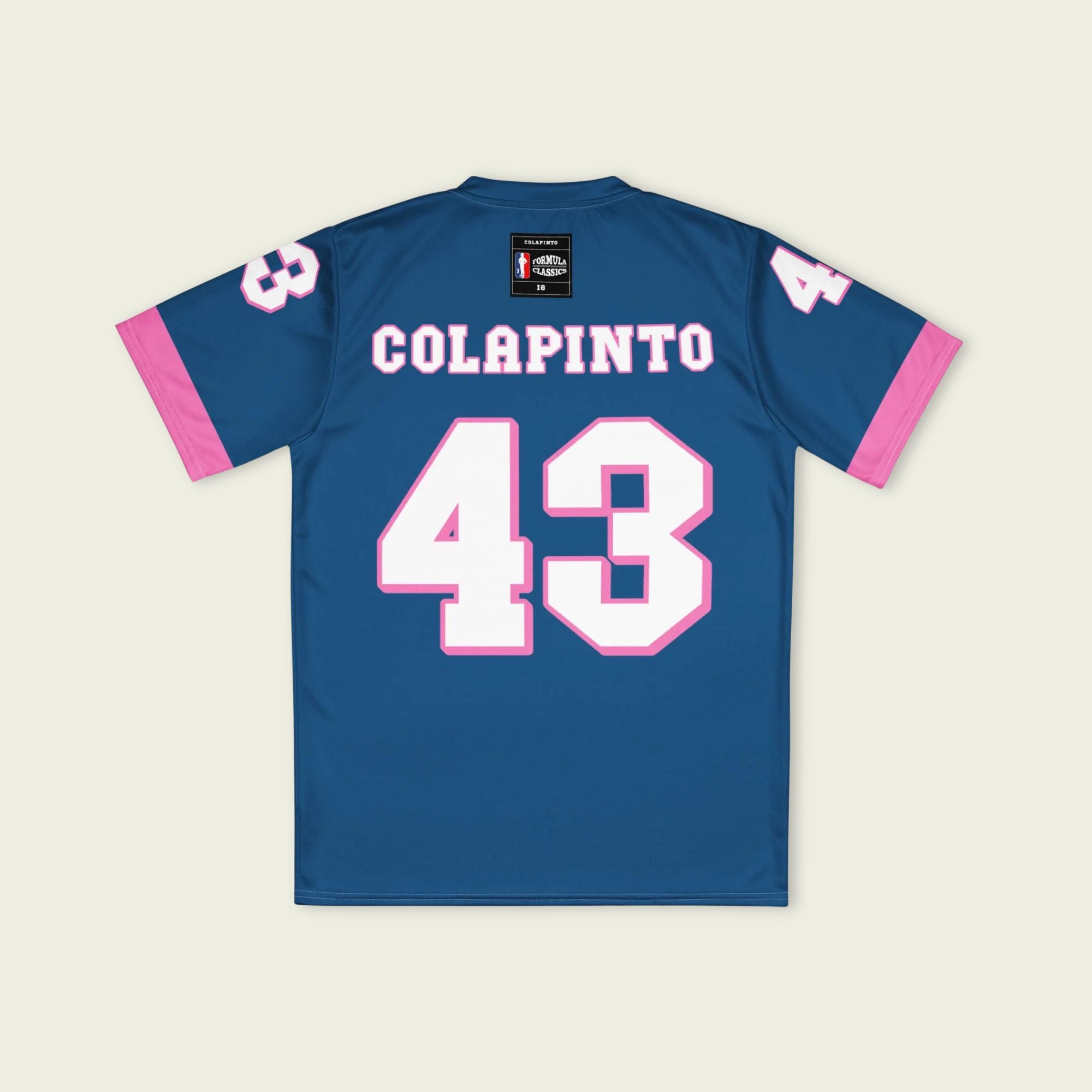 A navy blue and pink football jersey with Franco Colapinto's Alpine F1 Racing number 43 in white on the front and back.