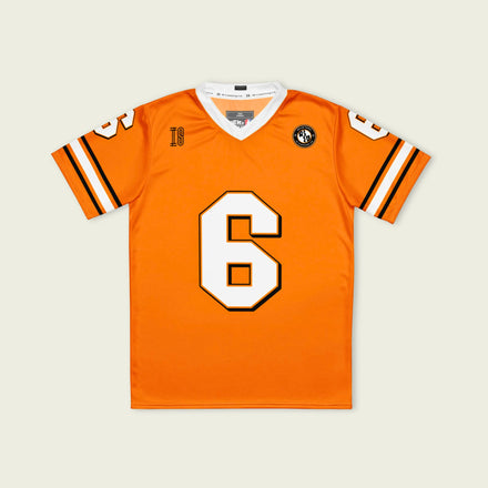 Orange sports jersey with number 6 on a beige background