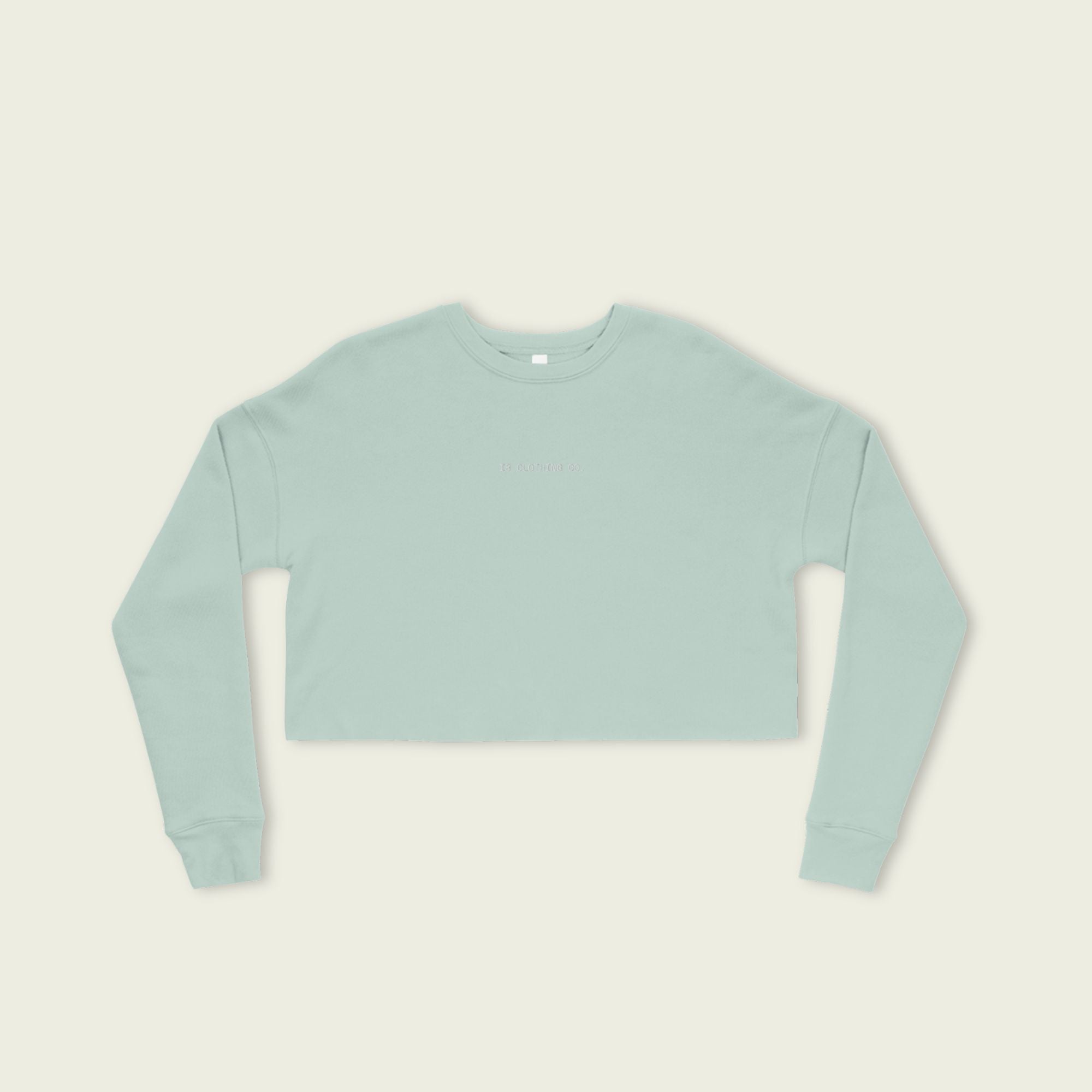 Light blue sweatshirt on a beige background