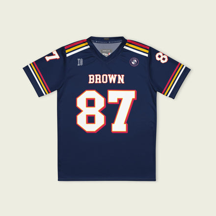 Navy blue sports jersey with 'Brown 87' on a beige background
