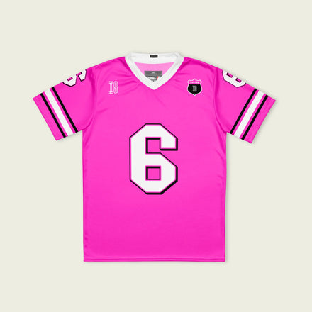 Pink sports jersey with number 6 on a light beige background
