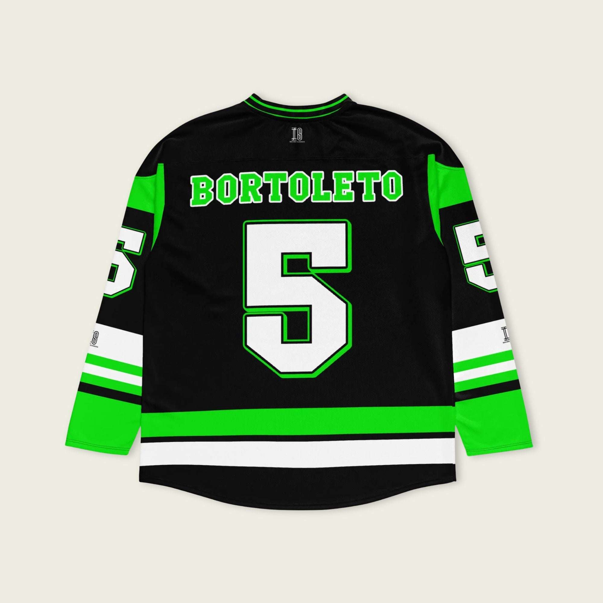 A green and black hockey jersey with Gabriel Bortoleto's Kick Stake F1 racing number 5 in green on the front and back. It has the name Gabriel Bortoleto on the back and front in green as well.