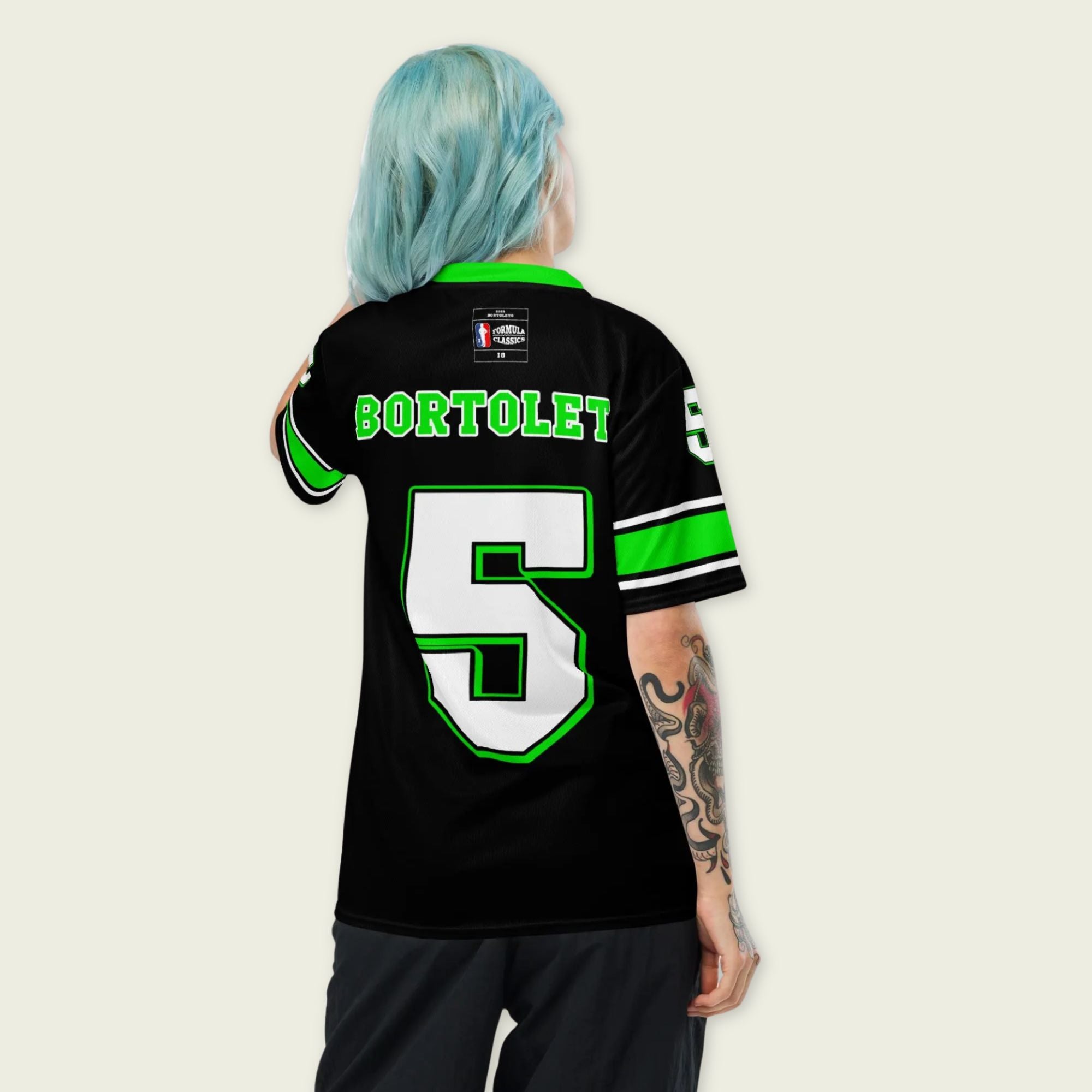 A black and highlight green football jersey with Gabriel Bortoleto's Kick Stake F1 racing number 5 on the front and back in green.