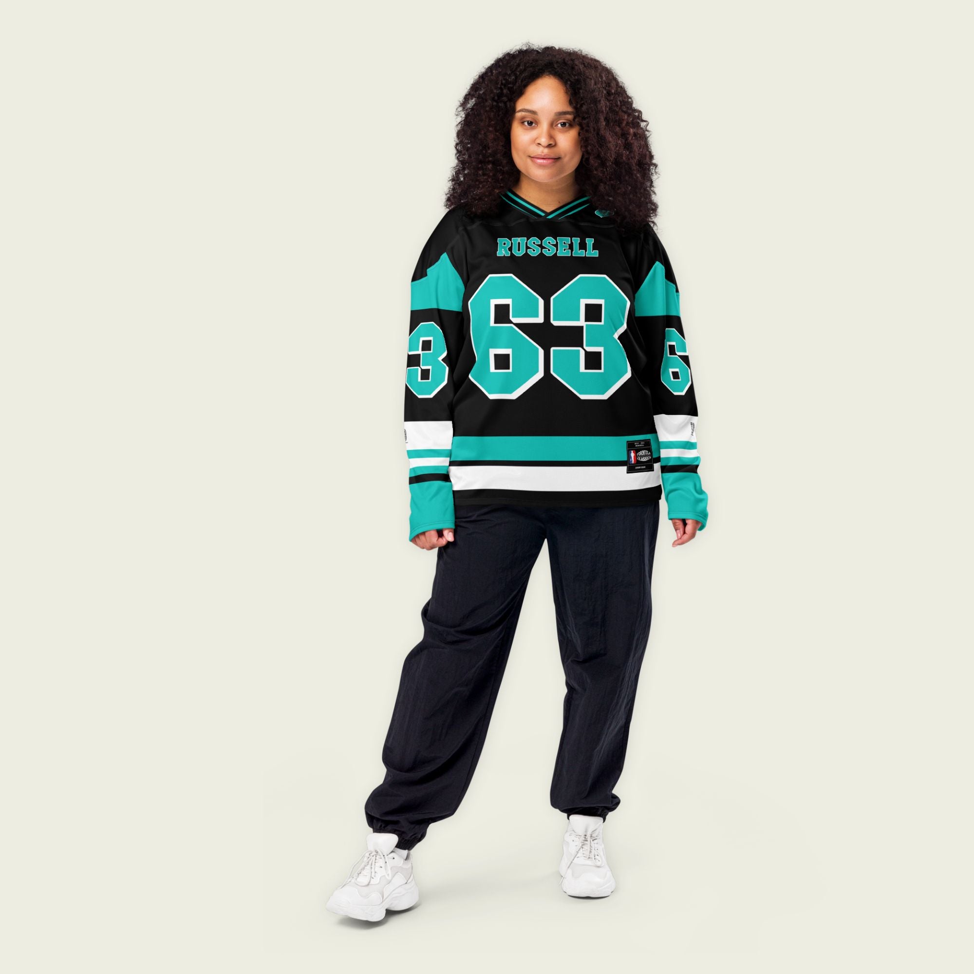 A black, green, and white hockey jersey with George Russells Mercedes F1 Racing number 63 in green on the front and back.