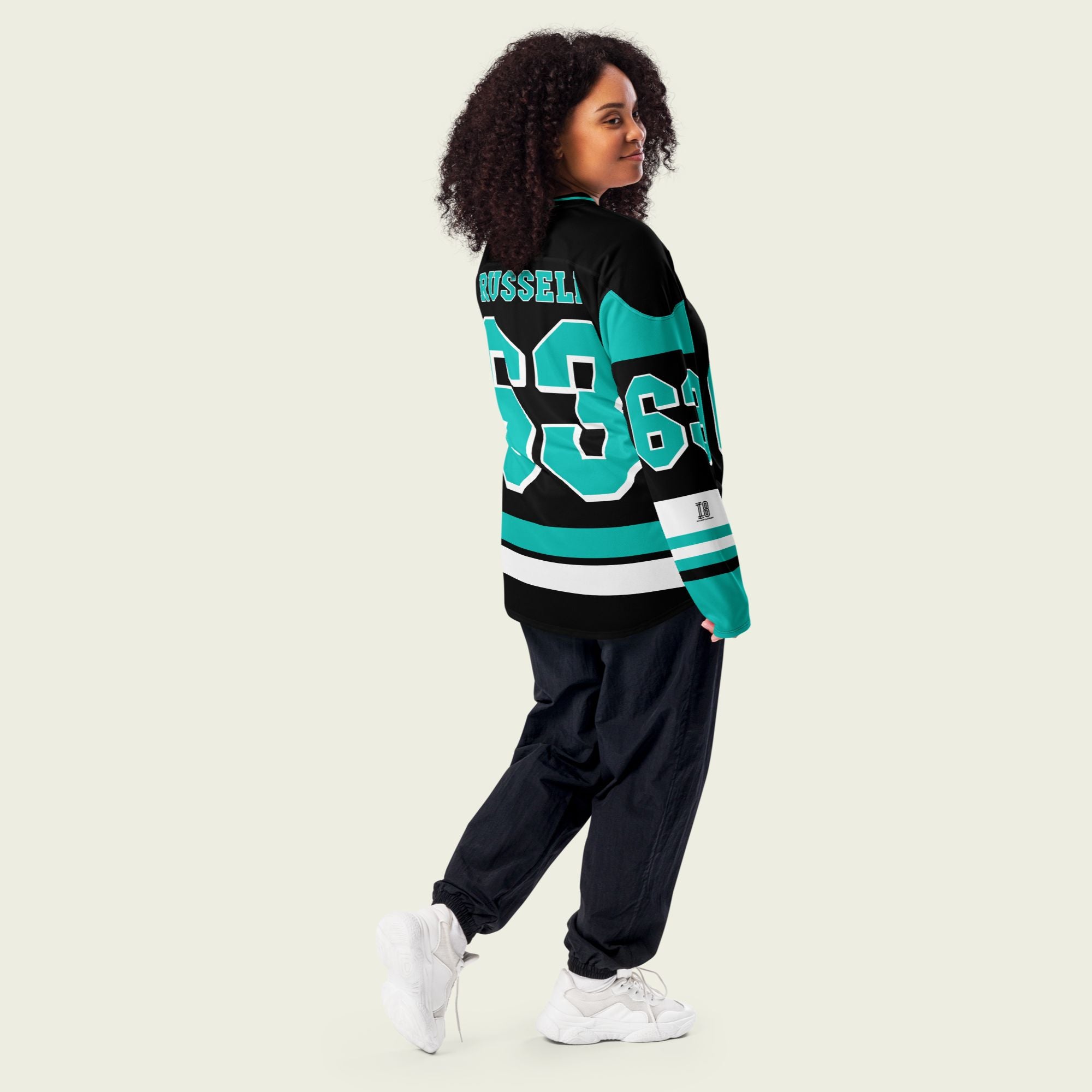 A black, green, and white hockey jersey with George Russells Mercedes F1 Racing number 63 in green on the front and back.
