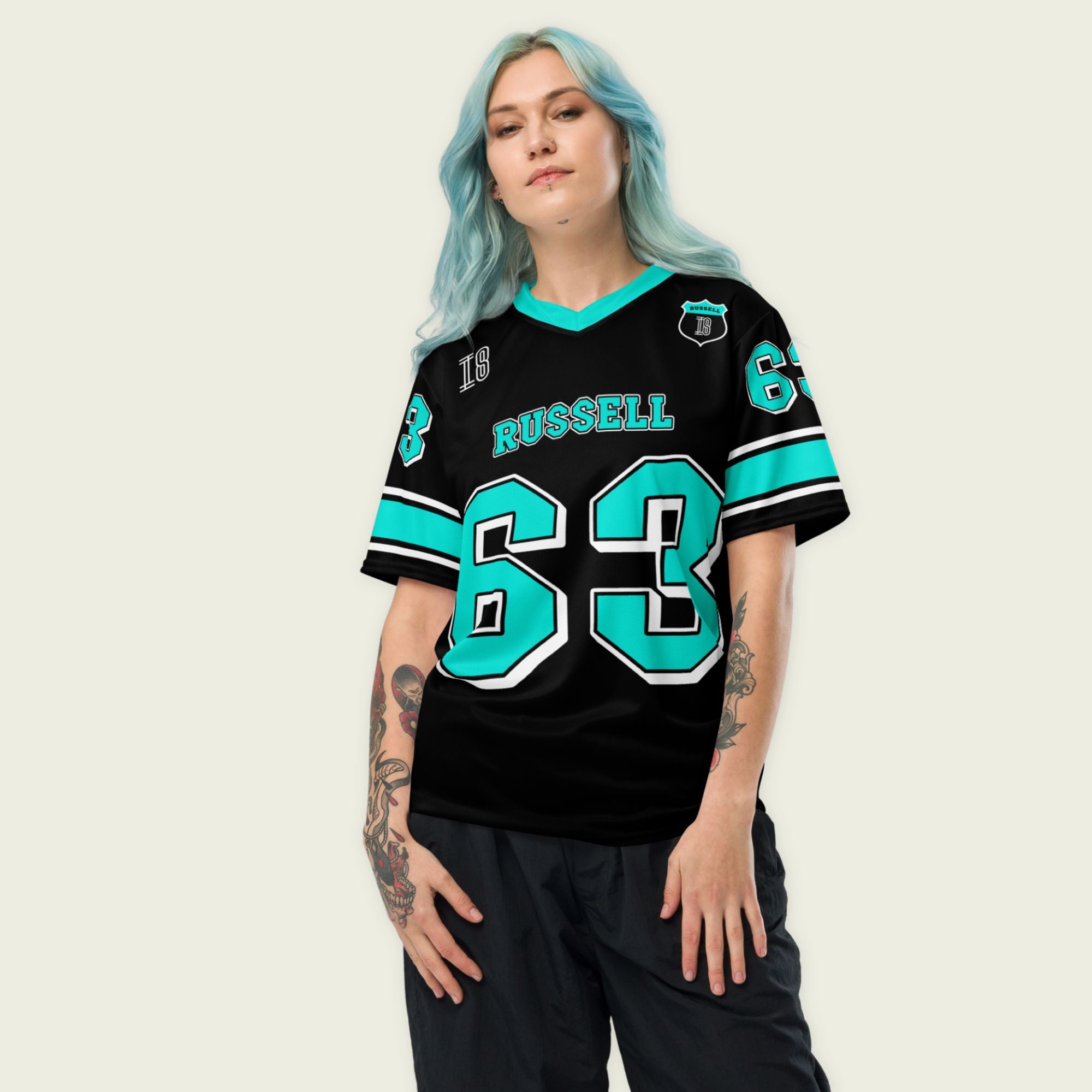 A black and highlight green football jersey with George Russell's Mercedes F1 racing number 63 on the front and back. The name Russell is on the front and back.