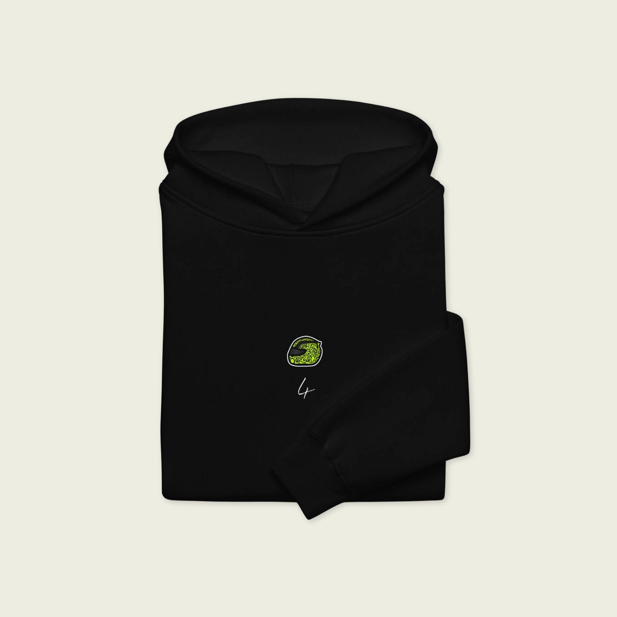 A black oversized hoodie with  white text Lando on the front  and lando norris's neon green helmut on the front.