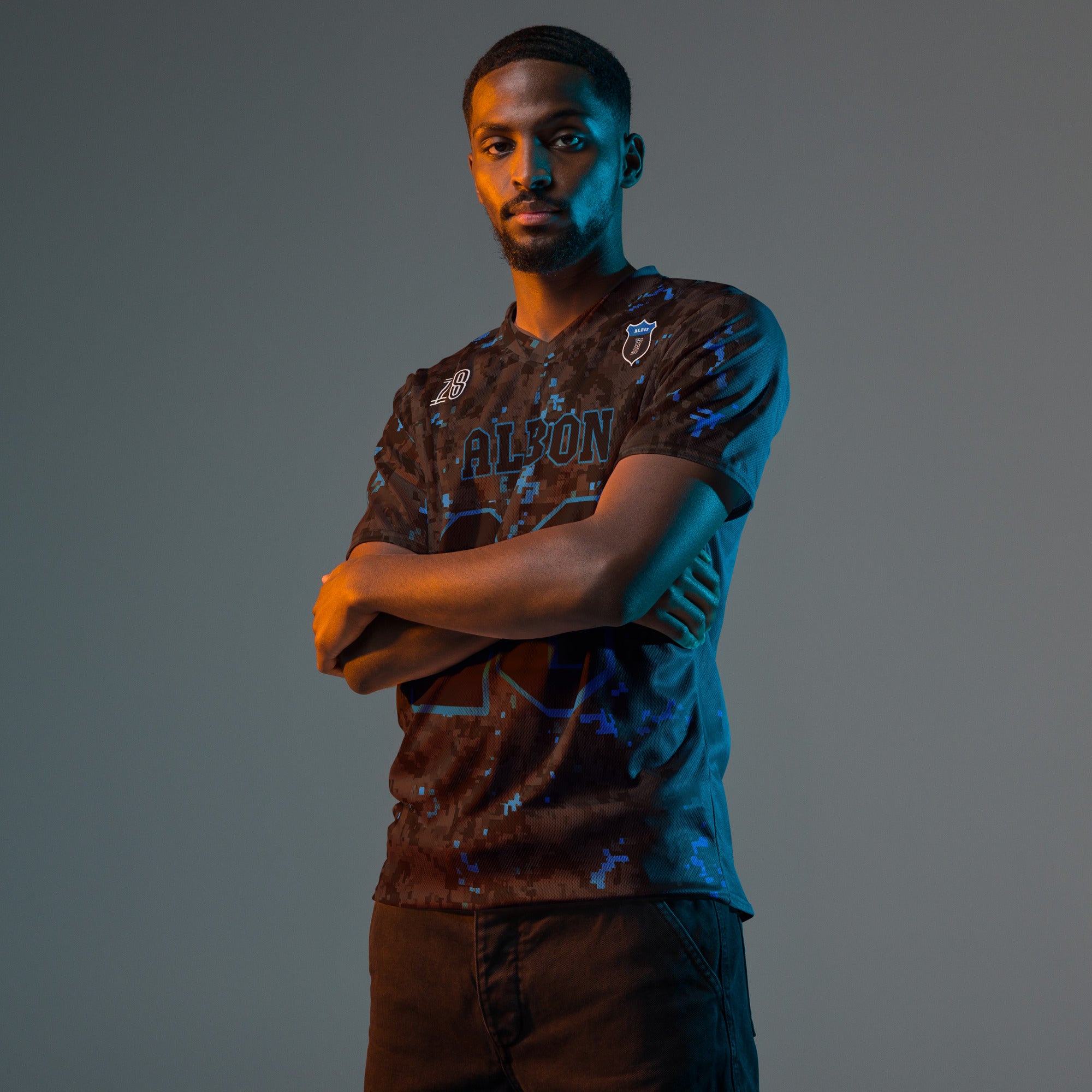 A camoflauge williams blue and black digital camo styled football jersey with  Alex Albons Williams F1 Racing number 23 on the front and back.