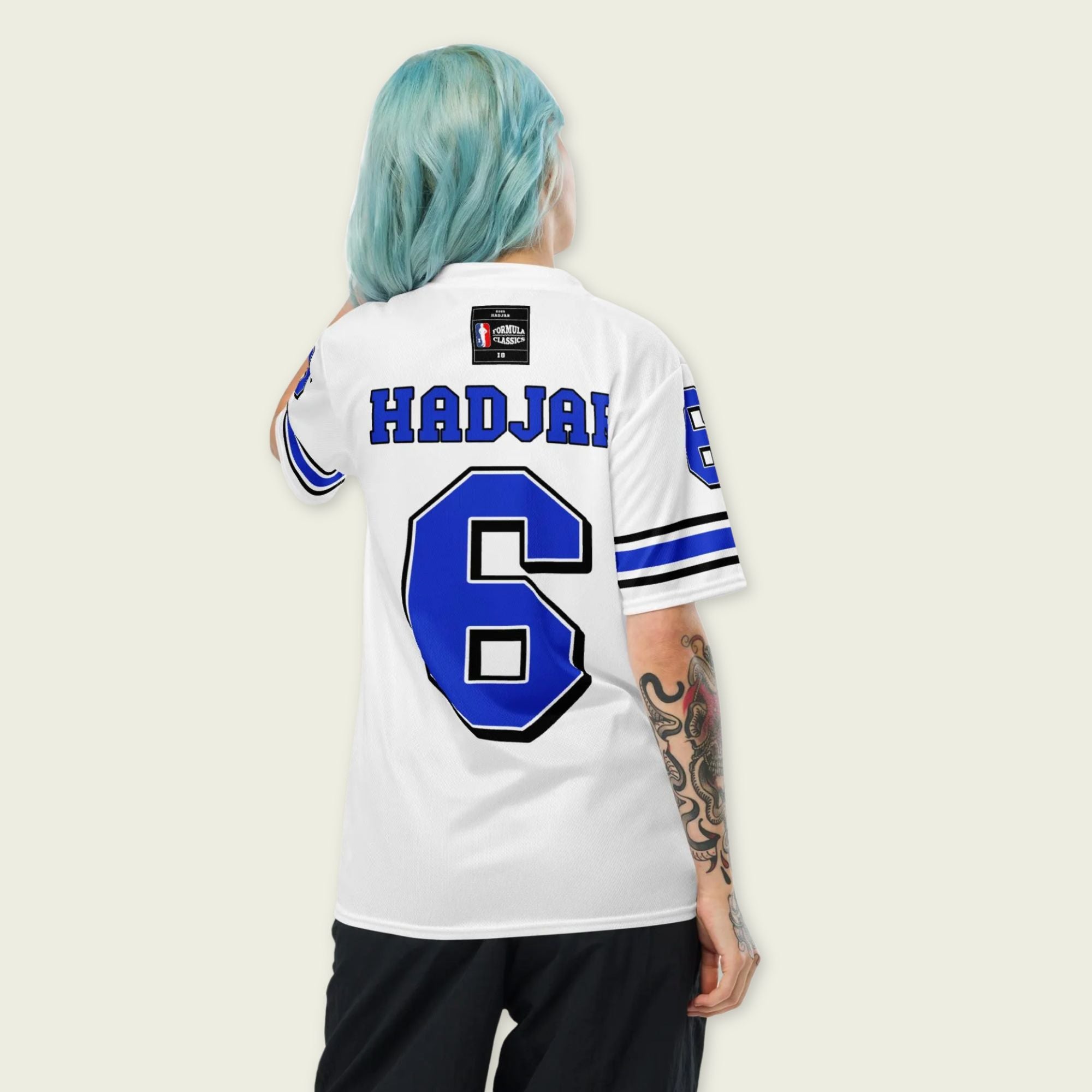 A white and blue football jersey with Isack Hadjars Redbull F1 Racing number 6 on the front and back.
