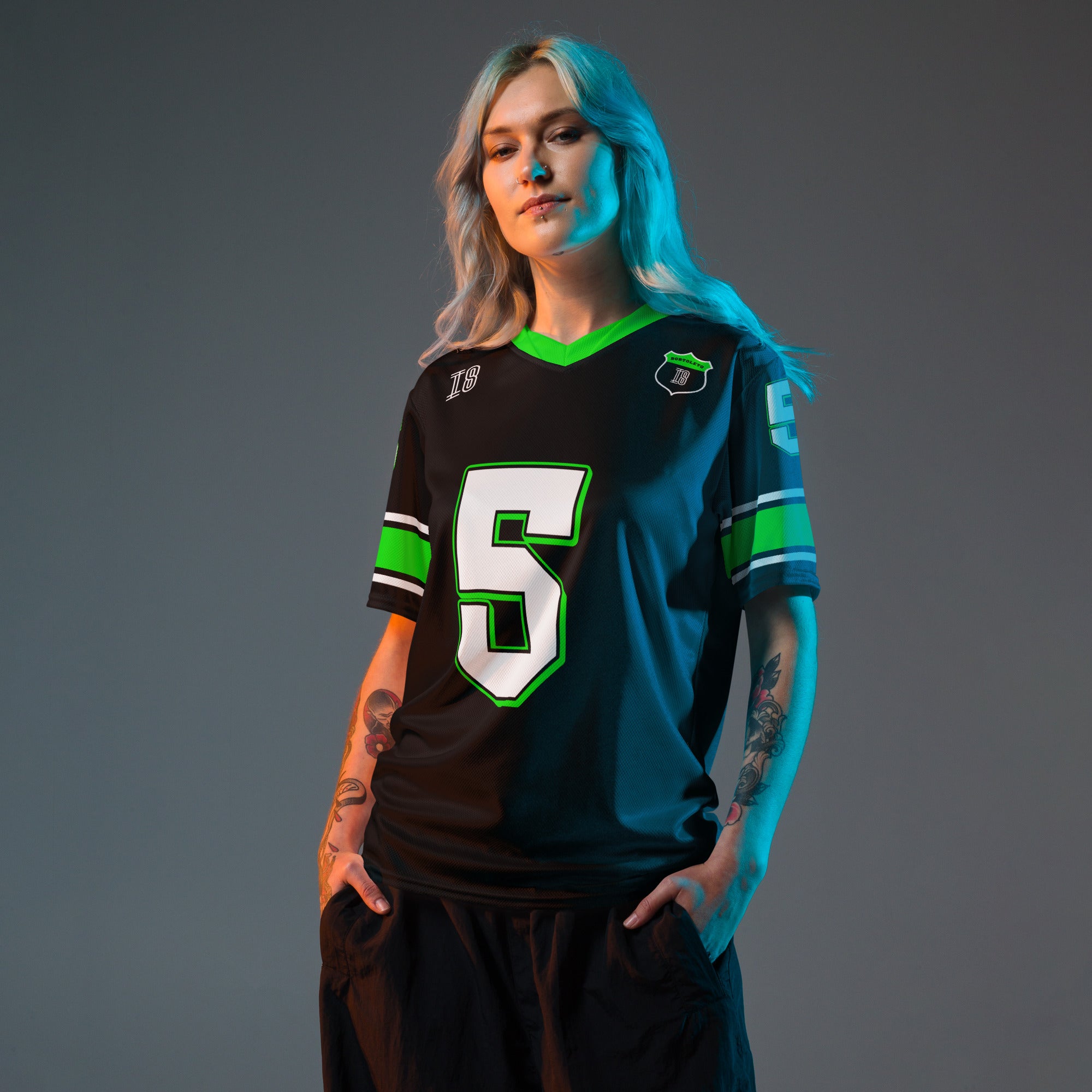 A black and highlight green football jersey with Gabriel Bortoleto's Kick Stake F1 racing number 5 on the front and back in green.