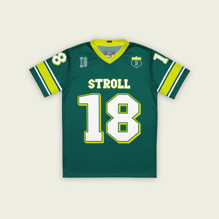 A british green and highlight yellow football jersey with Lance Stroll's Aston Martin F1 racing number 18 on the front and back. It has the name Stroll on the front and back as well in white with a yellow outline.