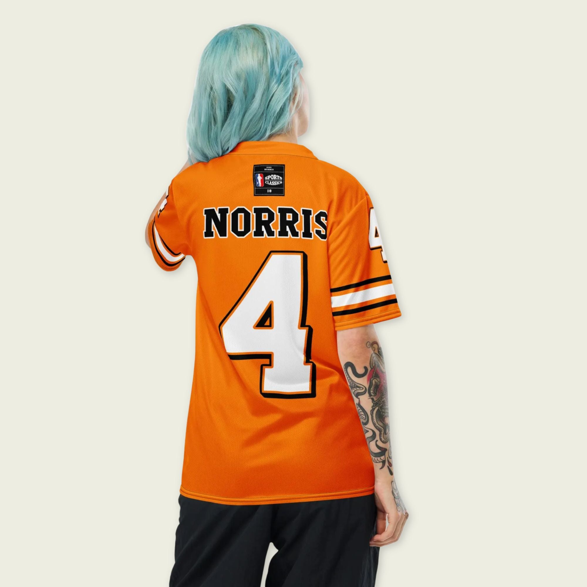 A papaya orange football jersey with Lando Norris's McLaren F1 Racing number 4 on the front and back.