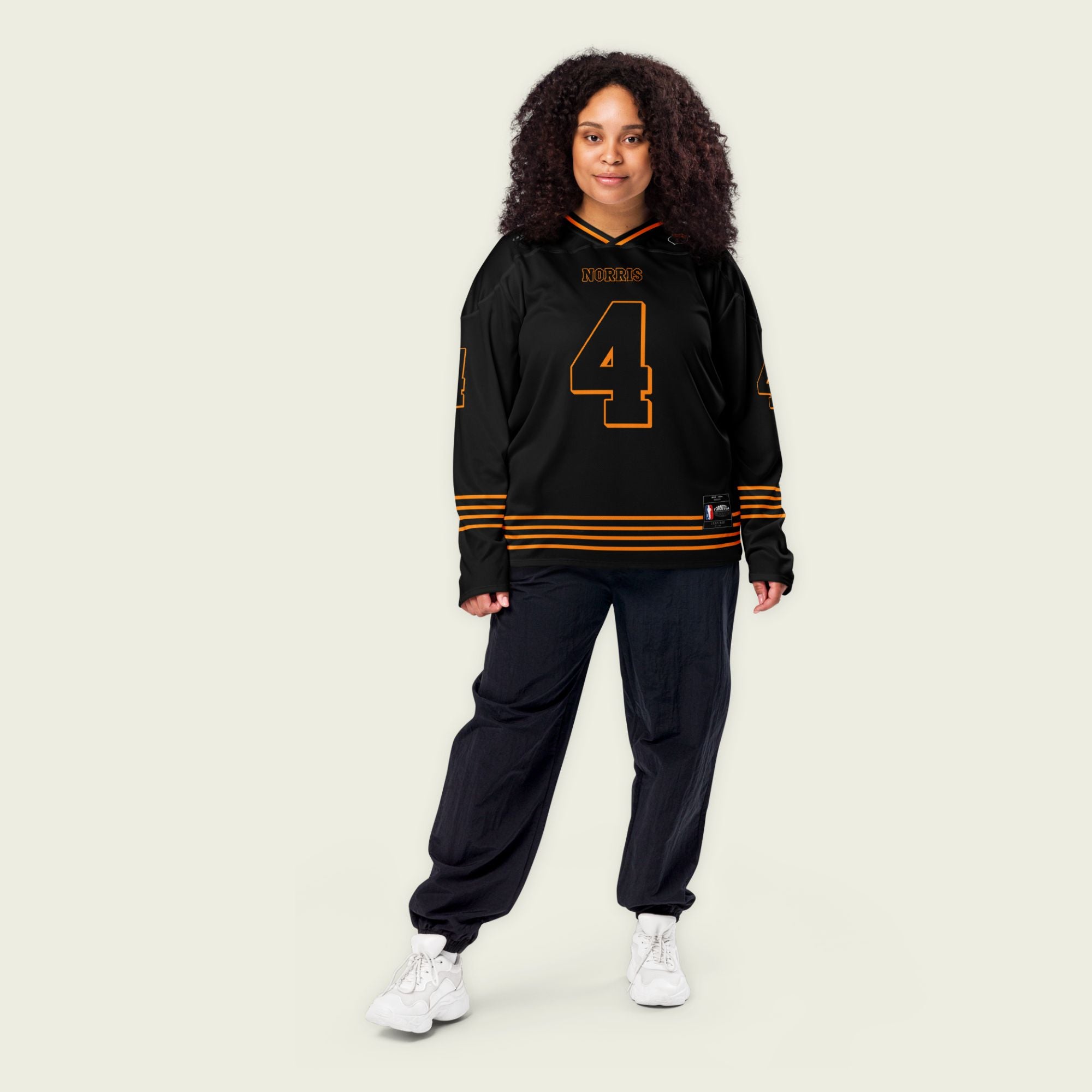 A black and papaya orange hockey jersey with orange stripes at the bottom, and Lando Norris's F1 racing number 4 on the front and back.