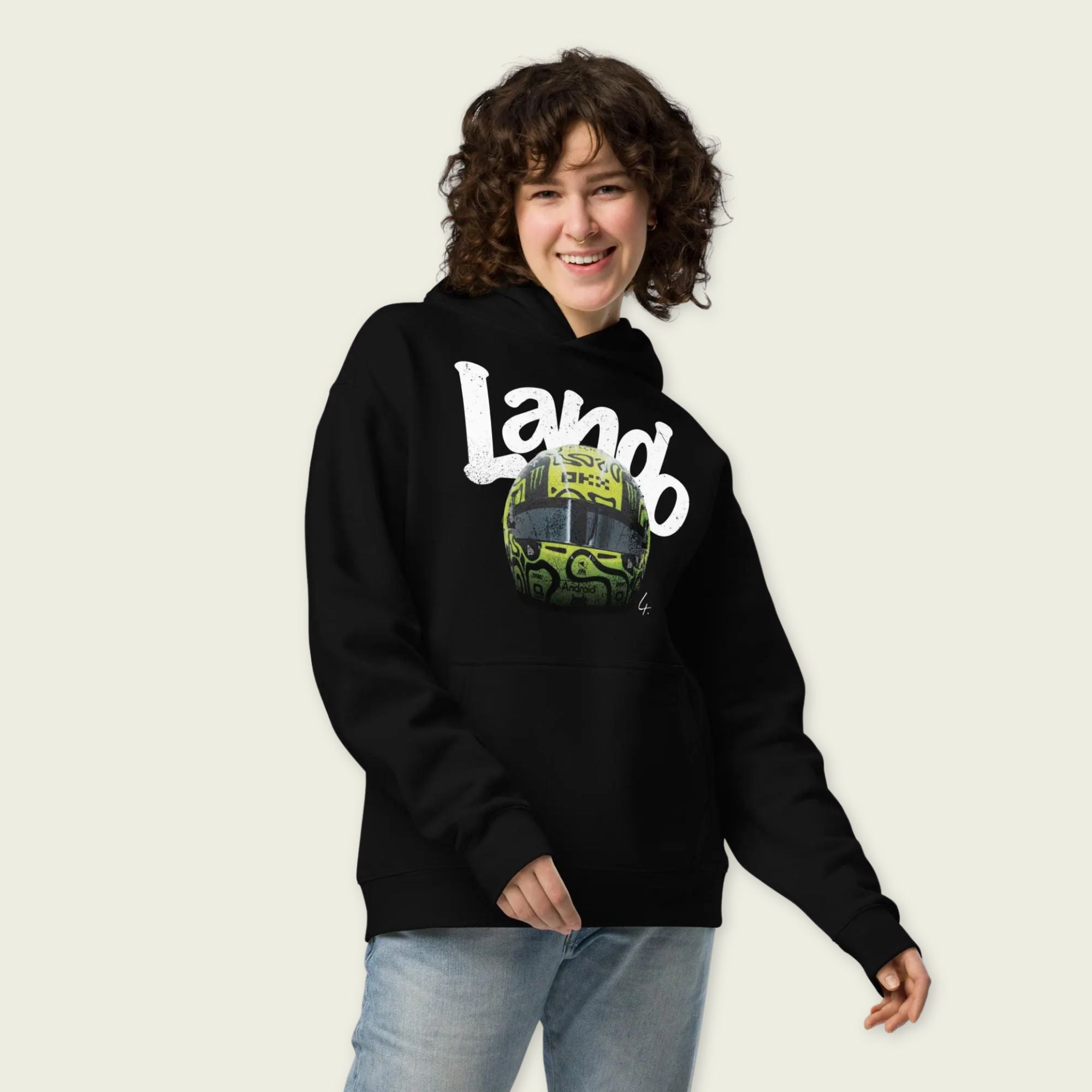 A black oversized hoodie with white text Lando on the front and lando norris's neon green helmut on the front.