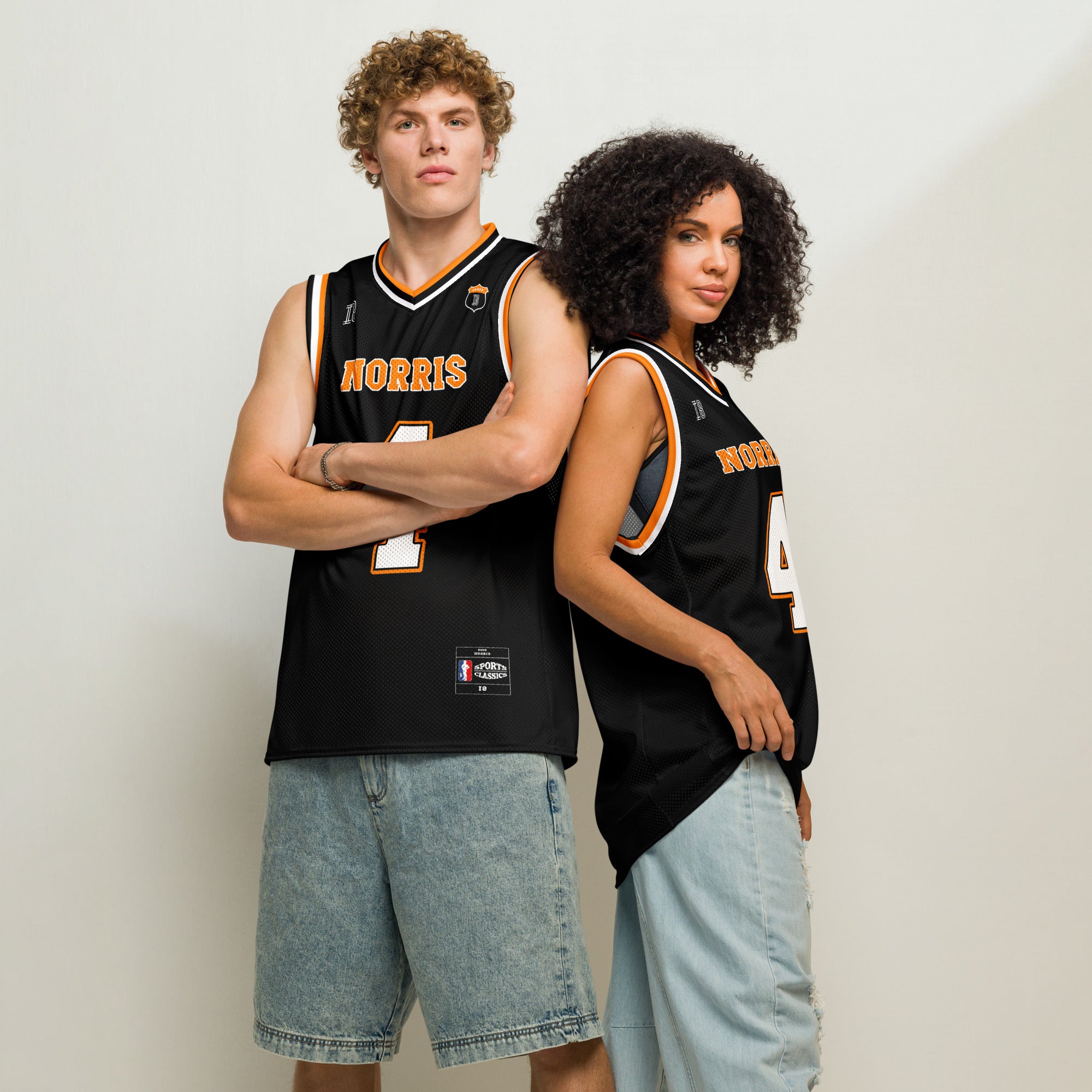A black and papaya orange basketball Jersey with Lando Norris's McLaren F1 racing number 4 in orange and white on the front and back.