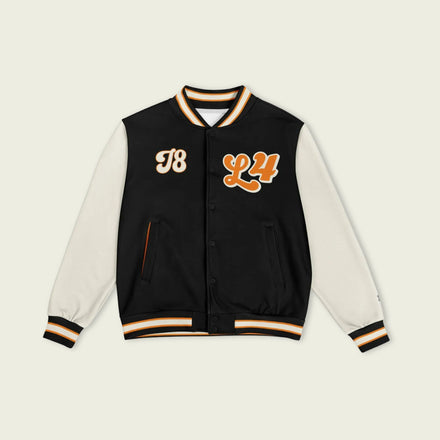 A black, papaya orange, and tan, varsity jacket with Oscar Piastri's McLaren F1 racing number 81 in orange on the front and back.