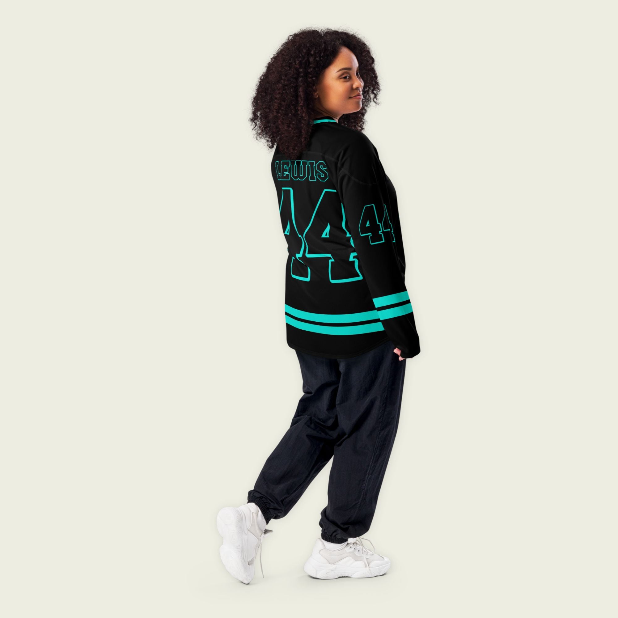 A black Lewis Hamilton hockey Jersey with his f1 racing number 44 in mercedes amg green color.
