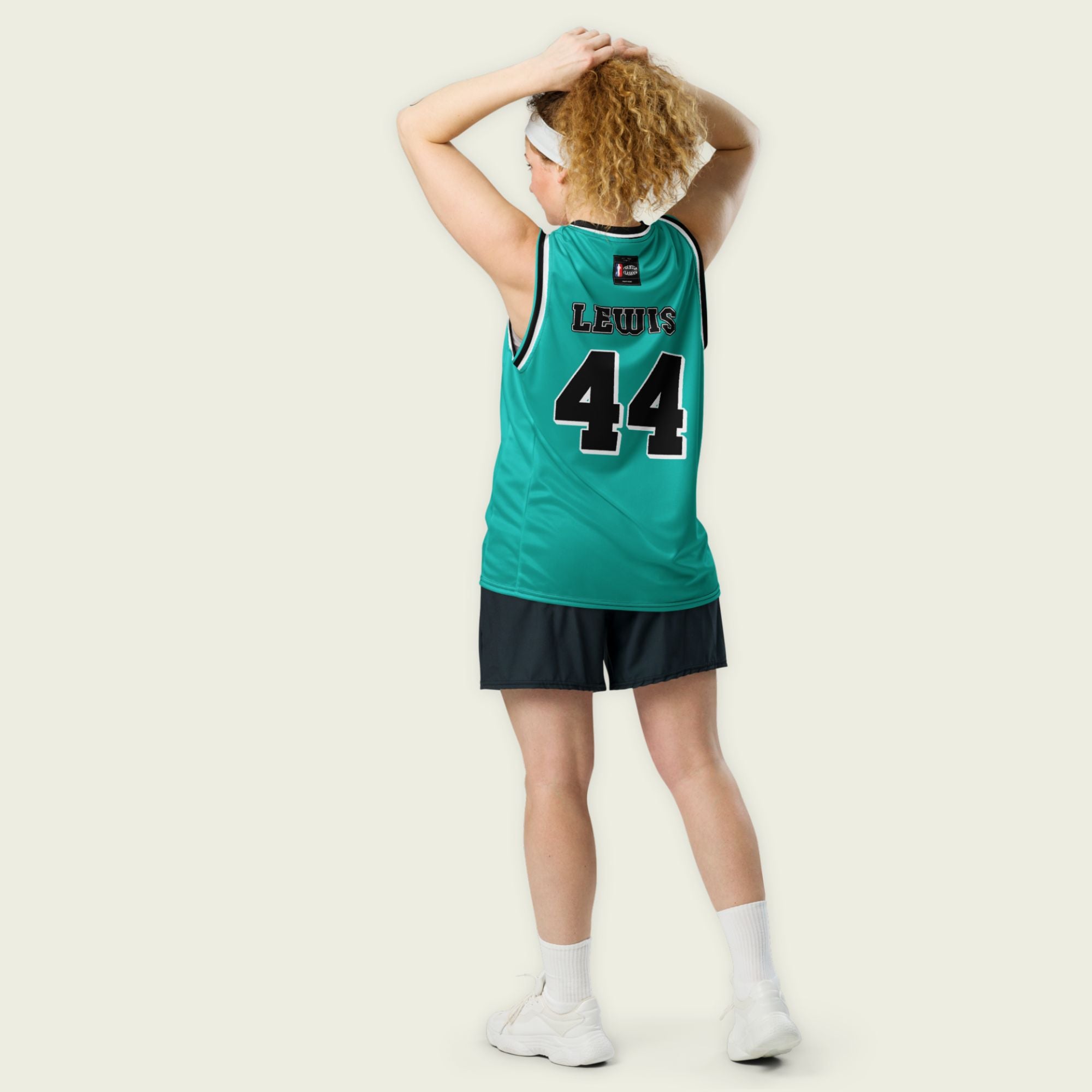A green basketball jersey with Lewis Hamilton's Mercedes F1 racing number on the front and back on the black.
